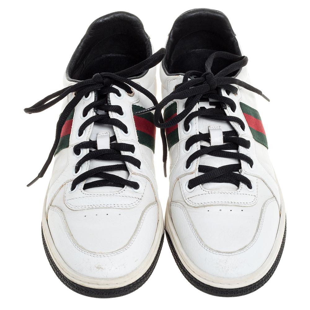 Stacked with signature details, this Gucci pair is rendered in leather and is designed in a low-cut style with lace-up vamps. These sneakers have been fashioned with the iconic web stripes. Complete with black trims on the counters, these shoes can