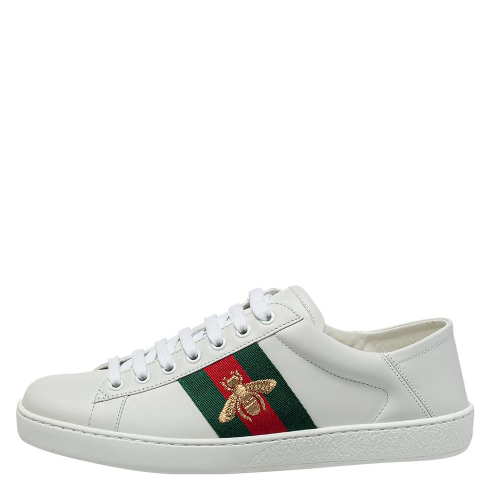 Stacked with signature details, this Gucci pair is rendered in white leather and is designed in a low-cut style with lace-up vamps. The sneakers have been fashioned with the iconic web stripes and embroidered bee motifs on the sides. Endowed with