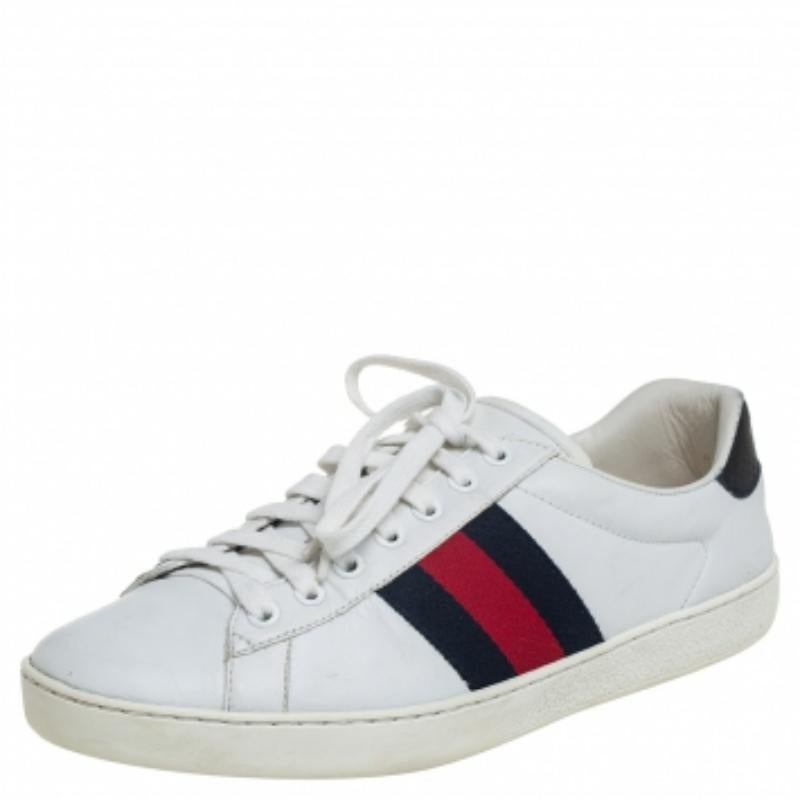 Stacked with signature details, this Gucci pair is rendered in leather and is designed in a low-cut style with lace-up vamps. They have been fashioned with the iconic Web stripes for a signature touch. Complete with python-embossed counters, these