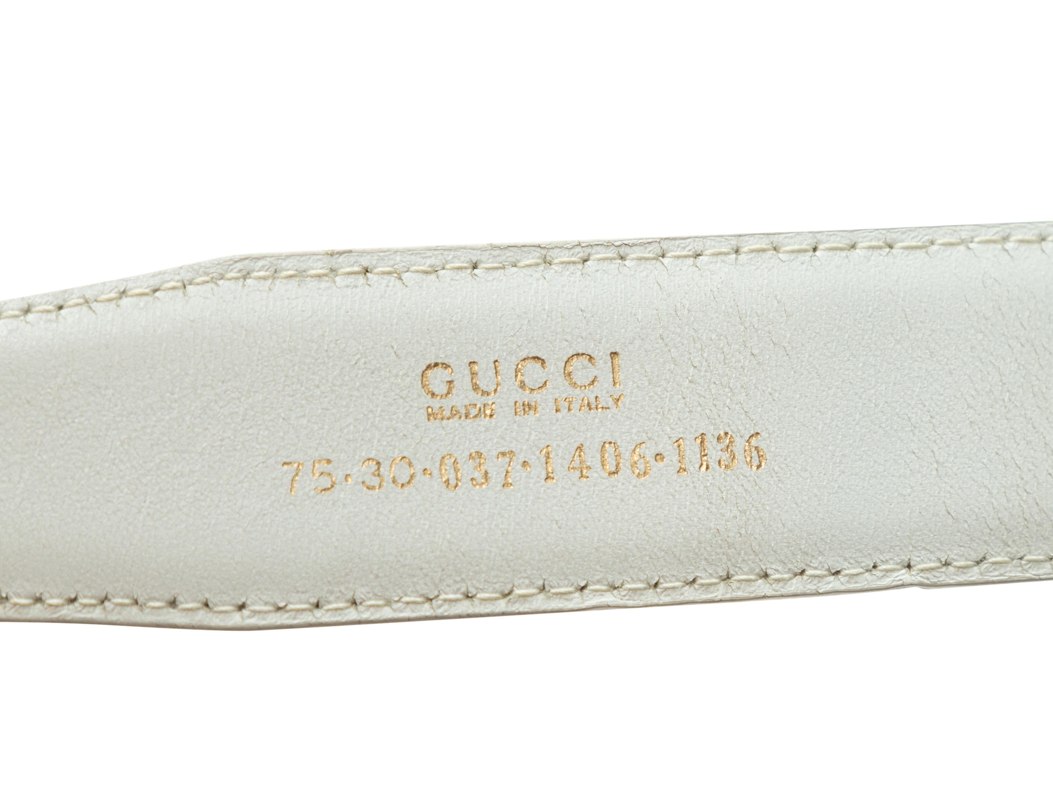Product Details: White leather belt by Gucci. Gold-tone buckle closure. 34