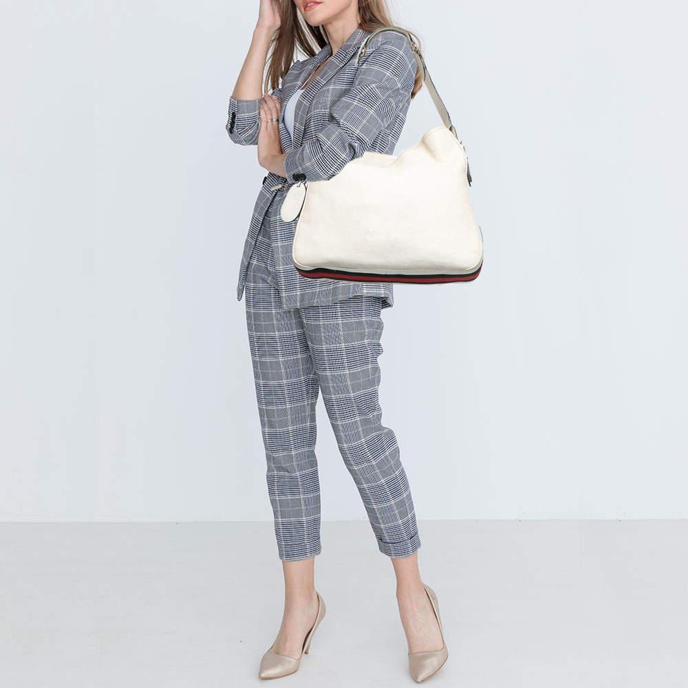This hobo from Gucci has been designed to be a worthy style companion! Crafted from leather, the bag features the Web trim for instant identification and a spacious interior to carry your essentials in.

Includes
Original Dustbag