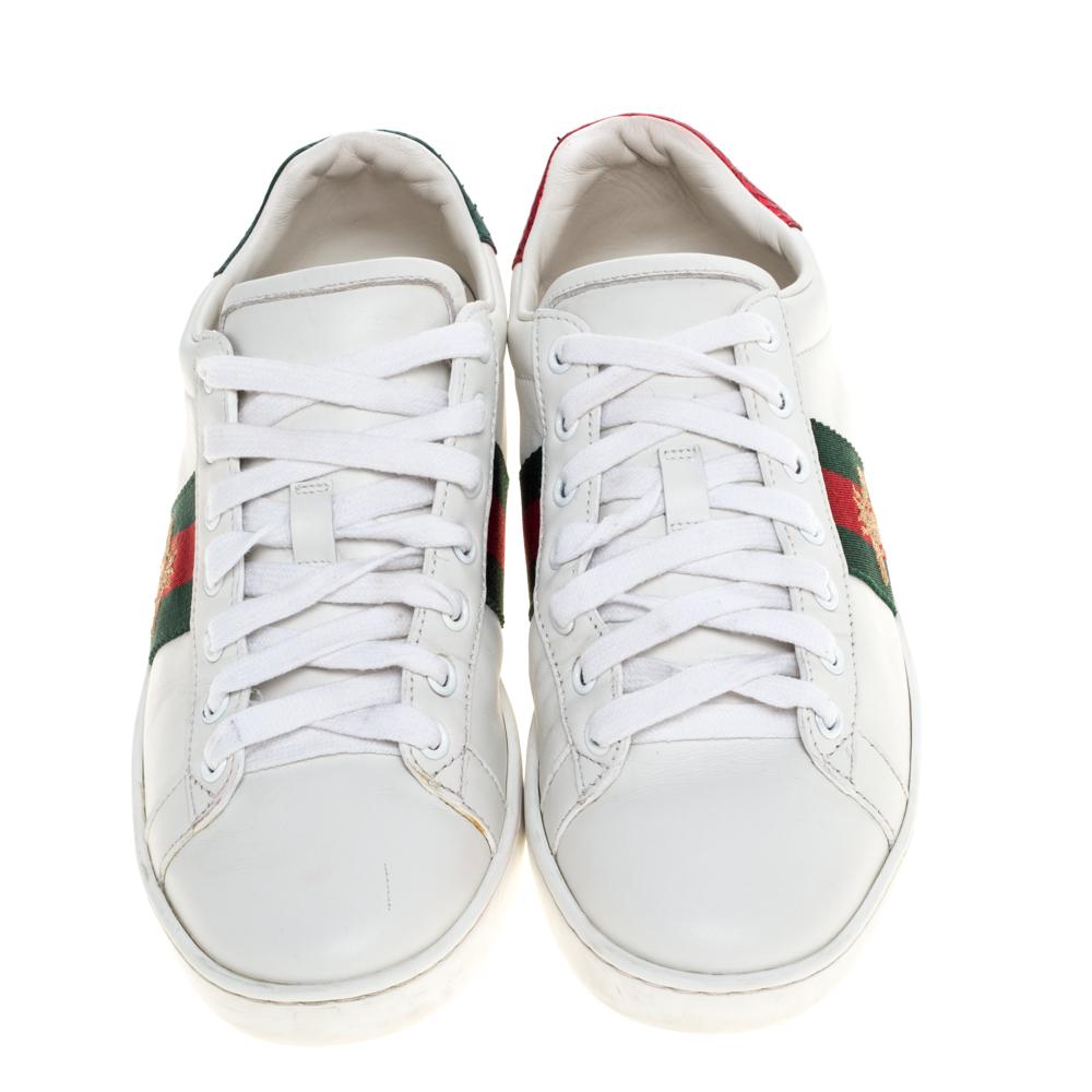 Stacked with signature details, this Gucci pair is rendered in leather and is designed in a low-cut style with lace-up vamps. They have been fashioned with the signature bee embroidery on the iconic web stripes. Complete with red and green trims