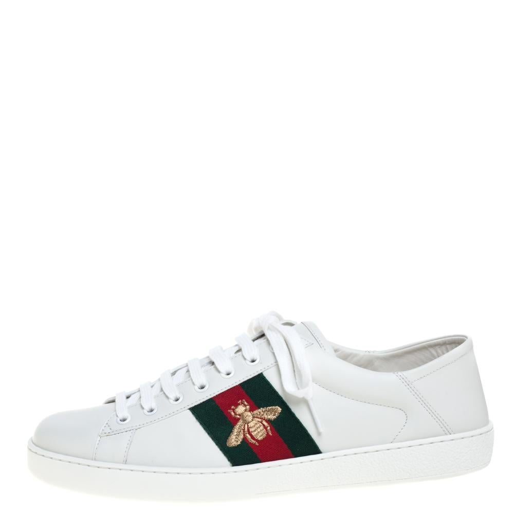 Stacked with signature details, this Gucci pair is rendered in leather and is designed in a low-cut style with lace-up vamps. The sneakers have been fashioned with the iconic web stripes and embroidered bee motifs on the sides. Complete with