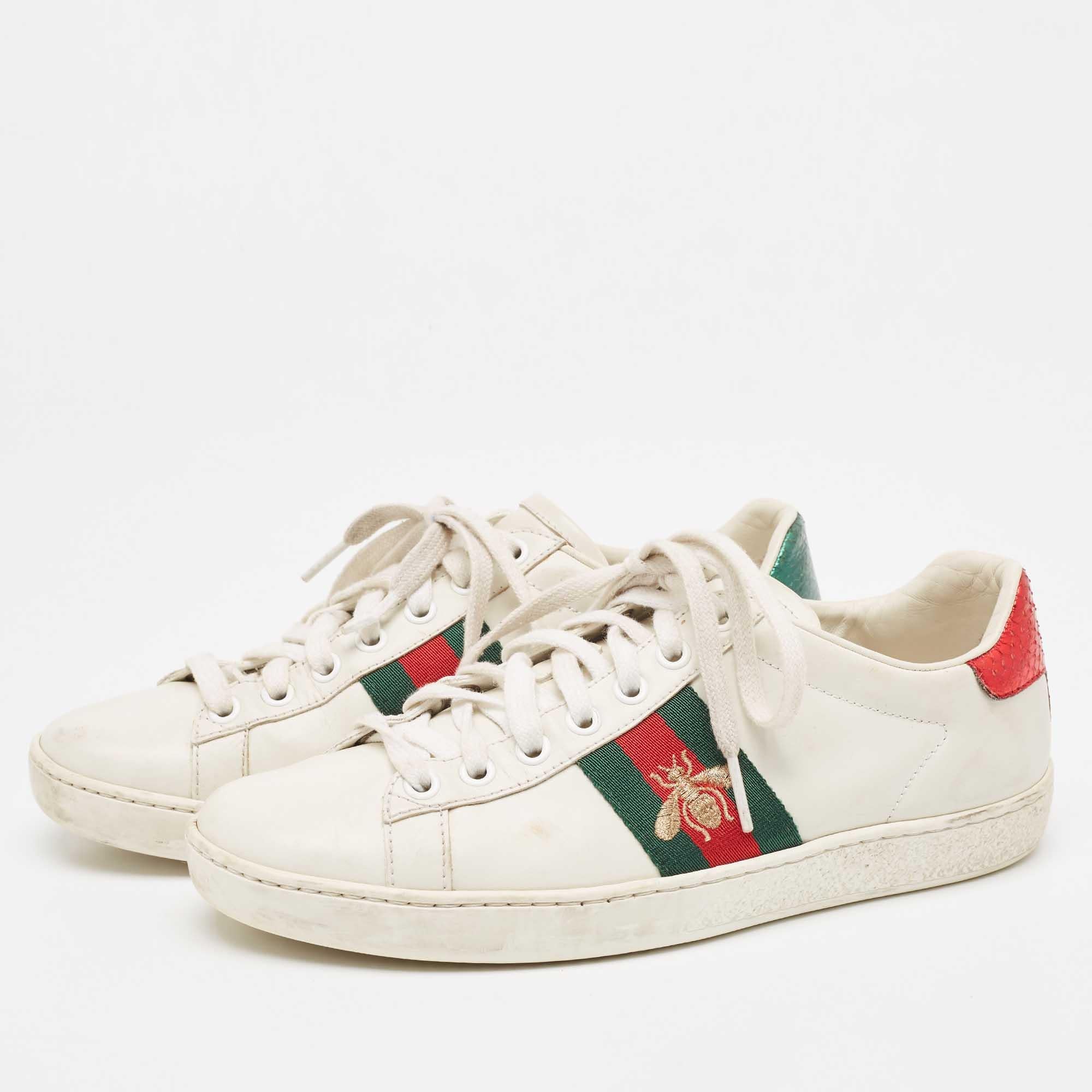 Stacked with signature details, this Gucci pair is rendered from leather on the exterior and these shoes have been fashioned with iconic web stripes along with a bee motif on the sides. Complete with brand detailing on the back, these shoes can be