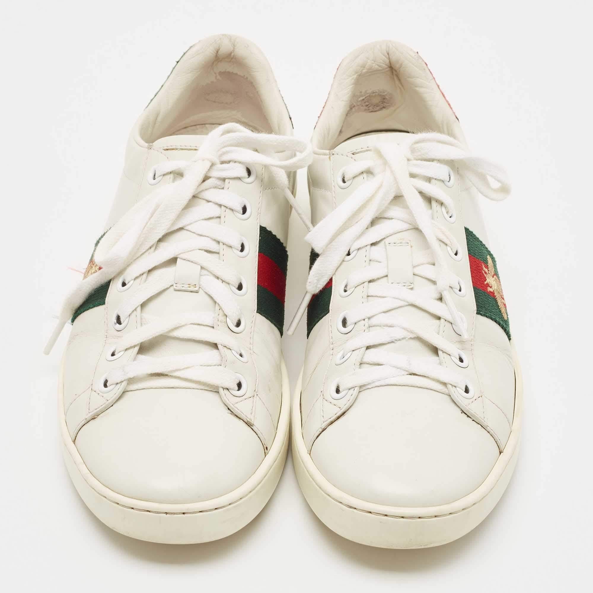 Stacked with signature details, this Gucci pair is rendered in leather and is designed with lace-up vamps, rubber soles, and the iconic bee motif on Web stripe. The visual display of this pair is enhanced with contrasting color trims carrying the