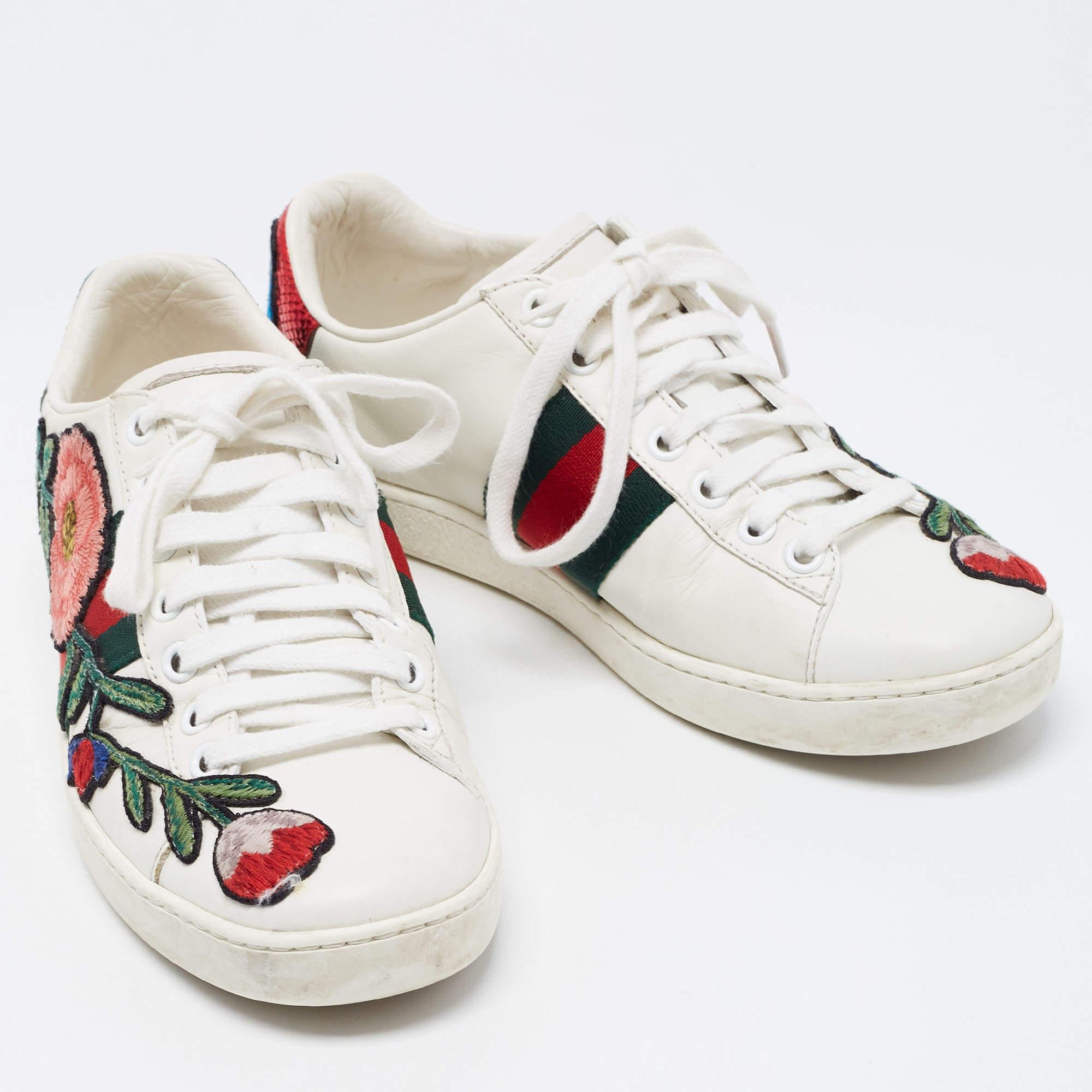 Stacked with signature details, this Gucci pair is rendered in leather and is designed in a low-cut style with lace-up vamps. They have been fashioned with the iconic web stripes and floral embroidery. Complete with red and green trims carrying the