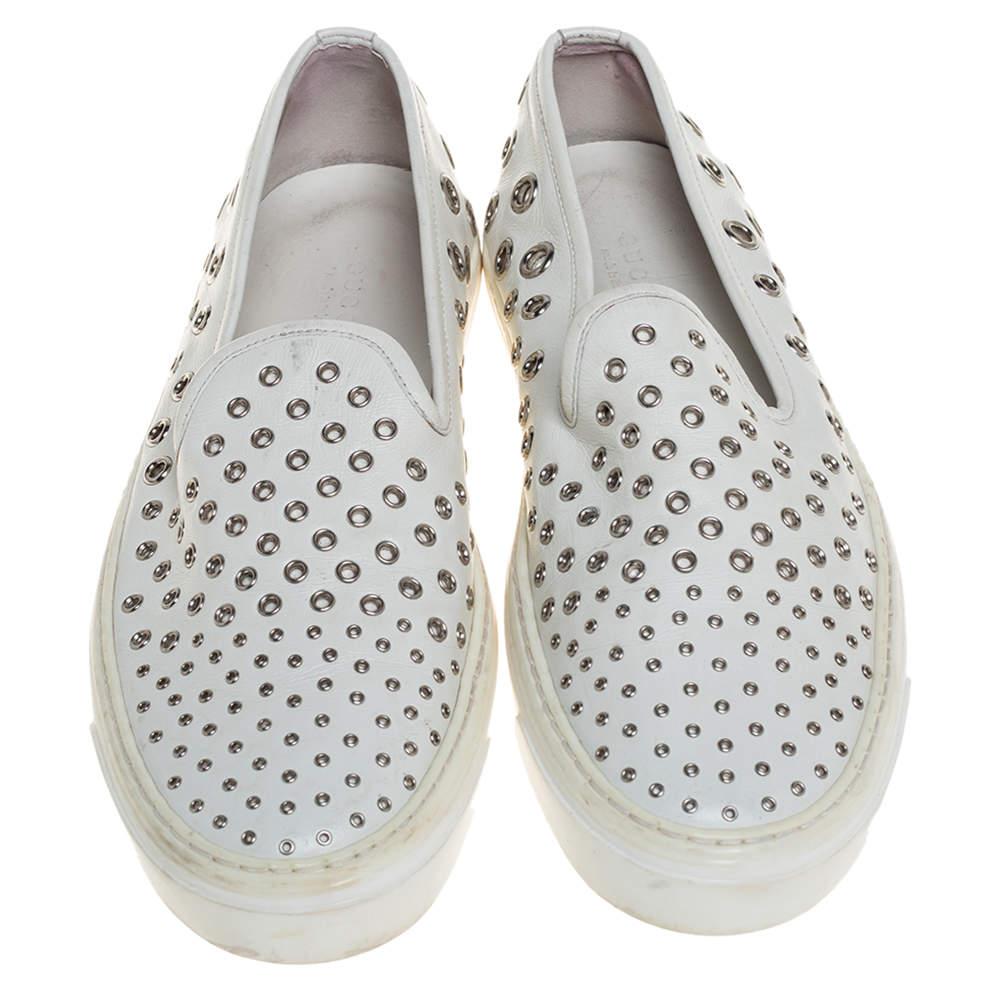 These Gucci slip-on sneakers may just be your ideal everyday shoes. You can just slip them on and be sure that you will be comfortable. They feature eyelet embellishments on the exterior and are finished with rubber soles.

