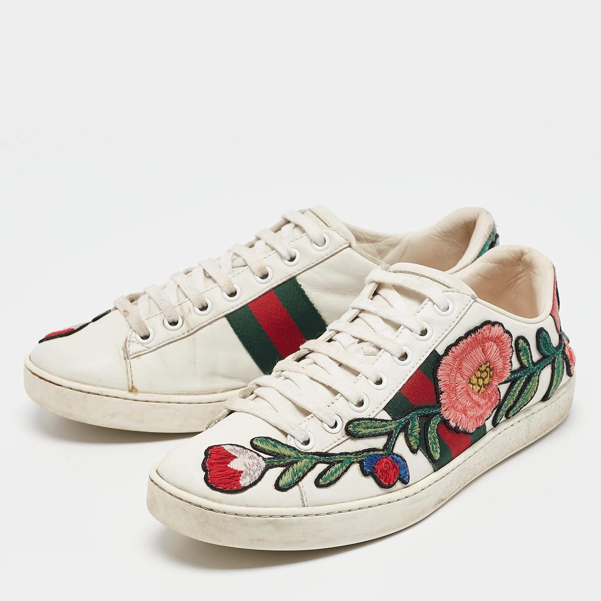 Stacked with signature details this Gucci pair is rendered in leather and is designed with lace up vamps. They have been fashioned with the iconic Web stripe and floral embroidered patches. Complete with contrasting embossed counters these shoes can