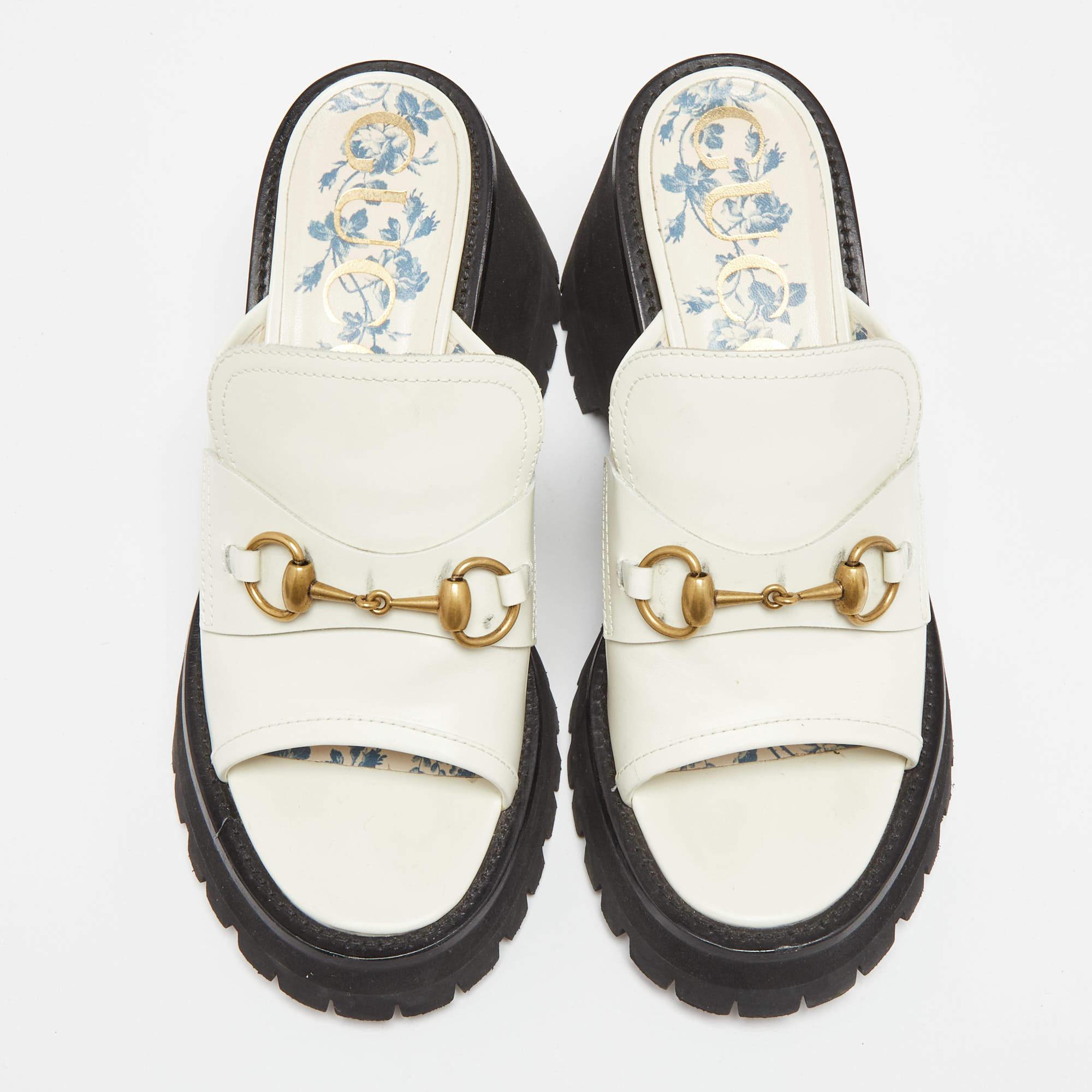 Wear these slides on days when you cannot choose between fashion and comfort, for they bring both. They are from Gucci, designed with platforms and the brand's Horsebit.

