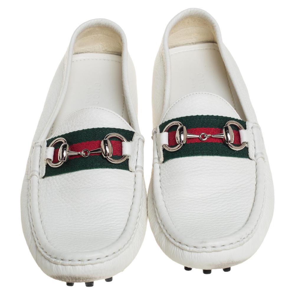 Exquisite and well-crafted, these Gucci loafers are worth owning. They have been crafted from white leather and they come flaunting the signature Horsebit and Web details on the vamps. The loafers are ideal to wear all day.

Includes: Original