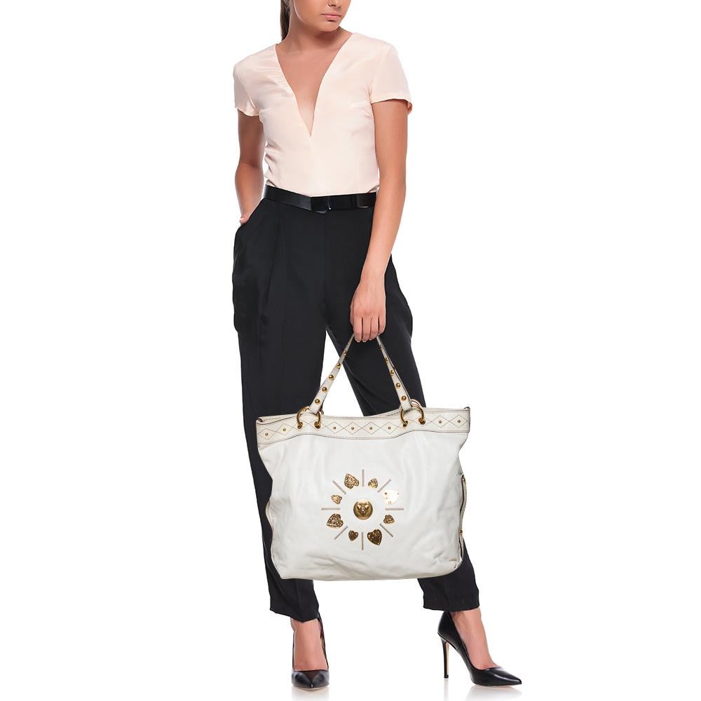 The ever-classic Gucci Irina tote is made of quality leather. A soft nylon lining covers the spacious interior of the bag while two handles offer a comfortable carrying option. The gold-tone hardware accents add the right finish.

Includes: Original