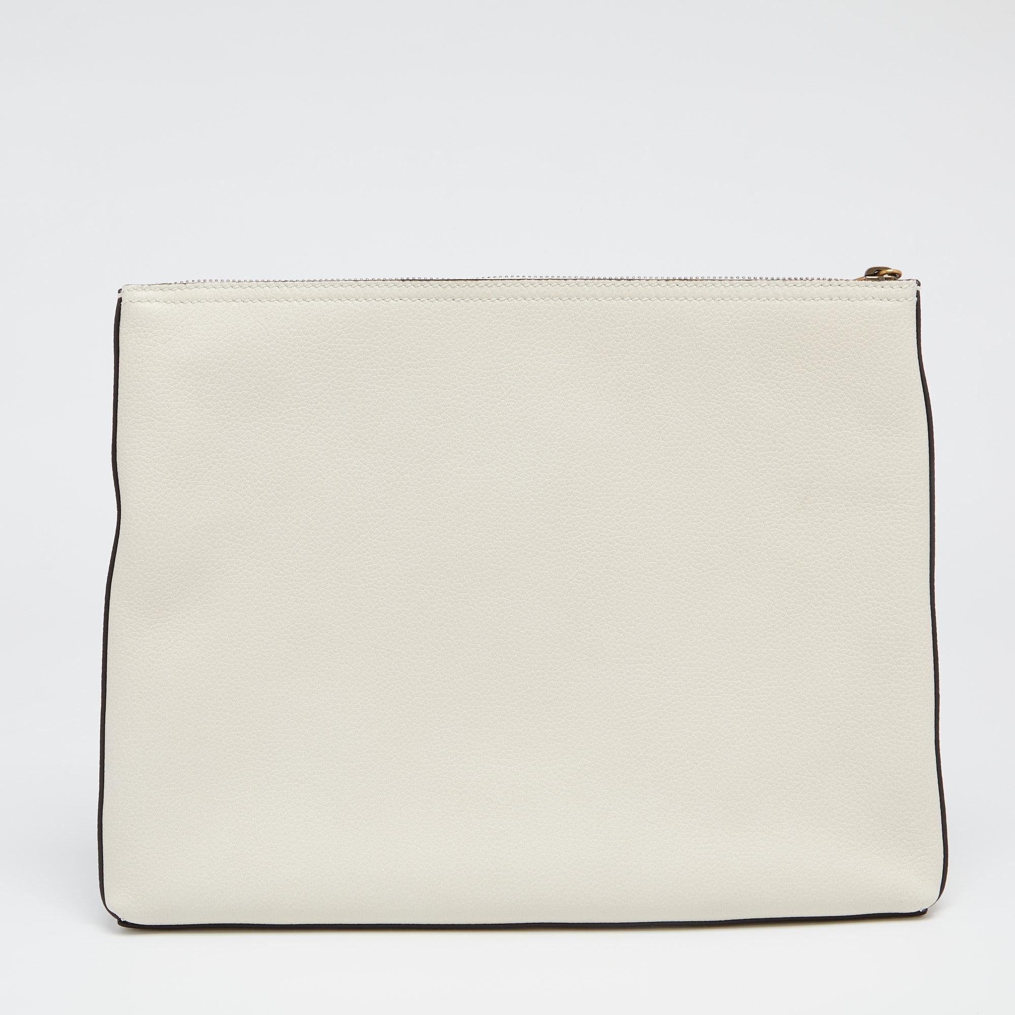 This women's pouch from Gucci has been made using quality leather in Italy. It has a suede-lined interior that is secured by a top zip closure. This white pouch has a simple shape and brand details printed on the front.

Includes: Original Dustbag,