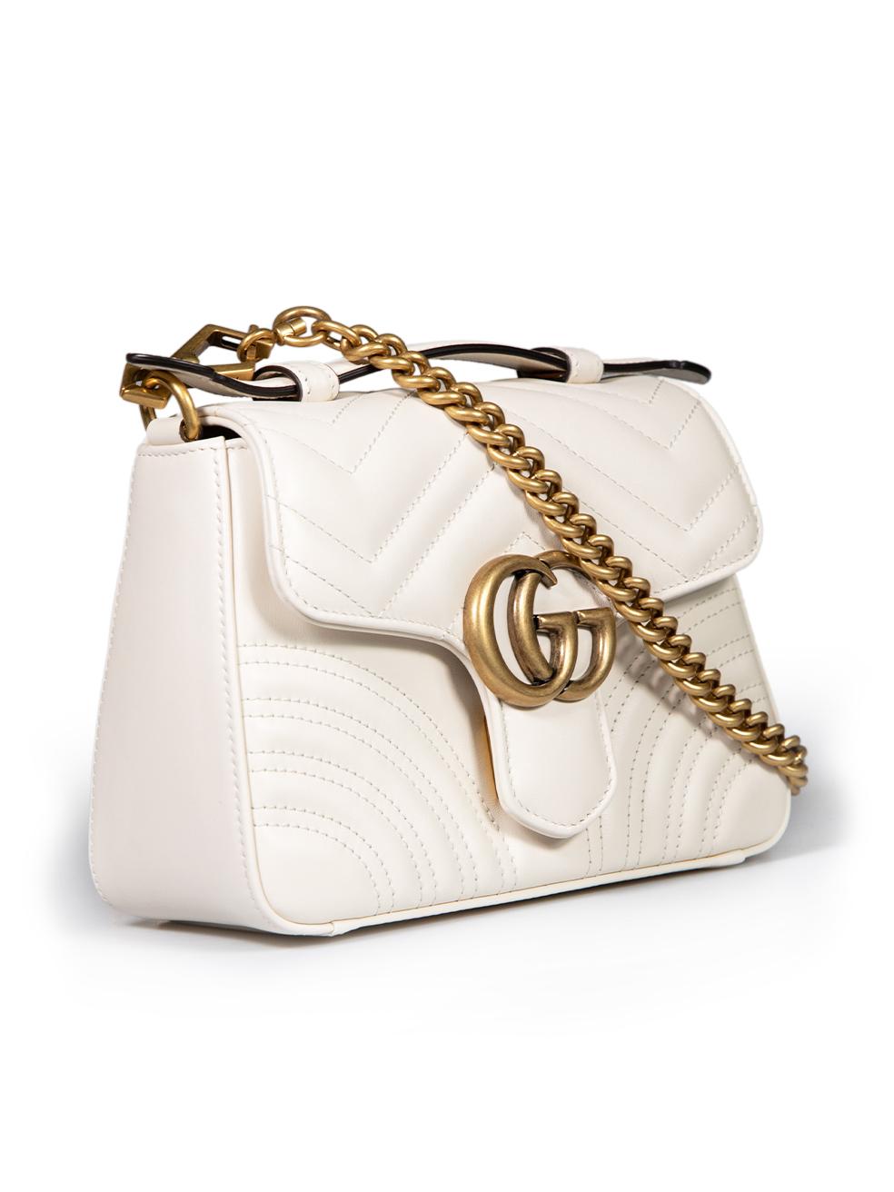 CONDITION is Never worn, however tiny scratch is seen to clasp hardware due to poor storage on this new Gucci designer resale item. This item comes with original dust bag and box.
 
 
 
 Details
 
 
 Model: GG Marmont
 
 White
 
 Leather
 
 Mini top