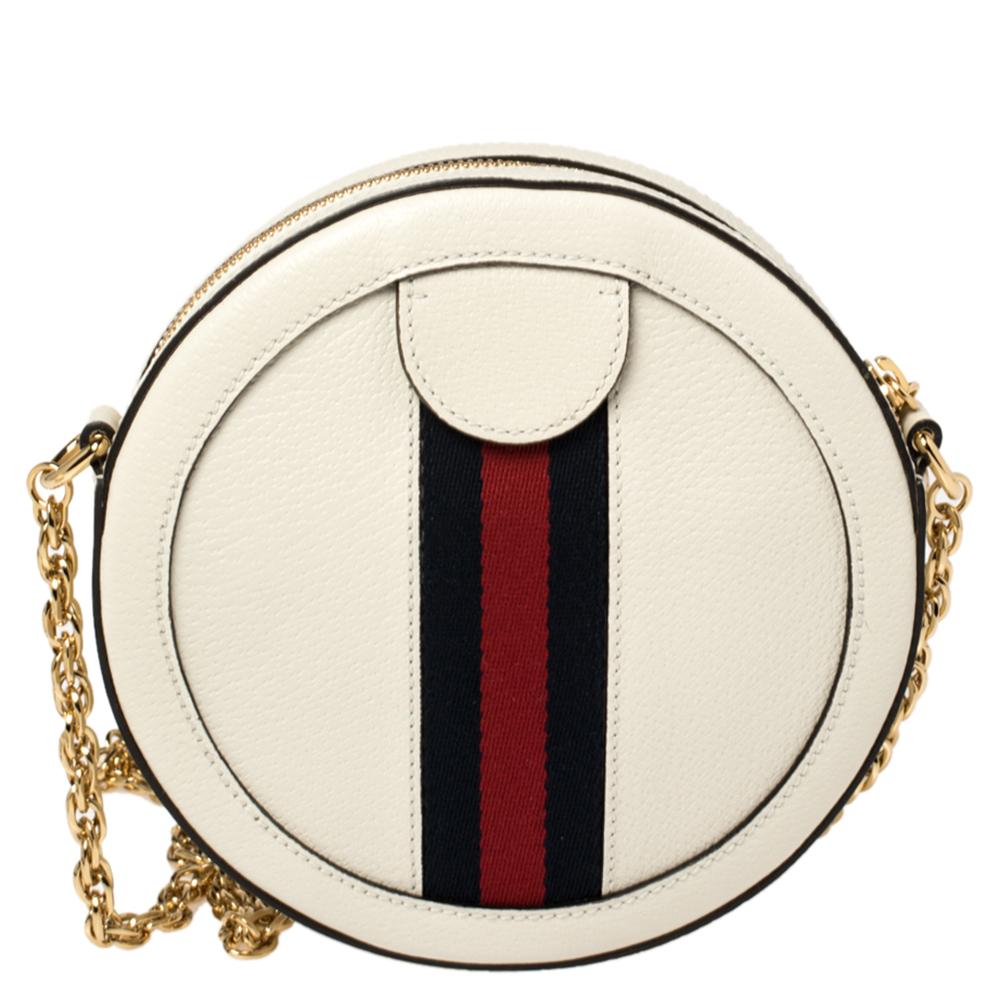 The iconic Ophidia collection by Gucci sees another lovely addition with this rounded shoulder bag. Crafted meticulously, it is rendered in white-hued leather and is accented with the signature Web detailing as well as the GG logo. The gold-tone