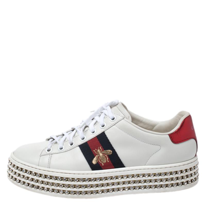 One's wardrobe is incomplete without a good pair of sneakers and what better than these Gucci ones! These New Ace sneakers have been crafted from white leather and styled with round toes, lace-ups on the vamps, the signature Web detailing on the