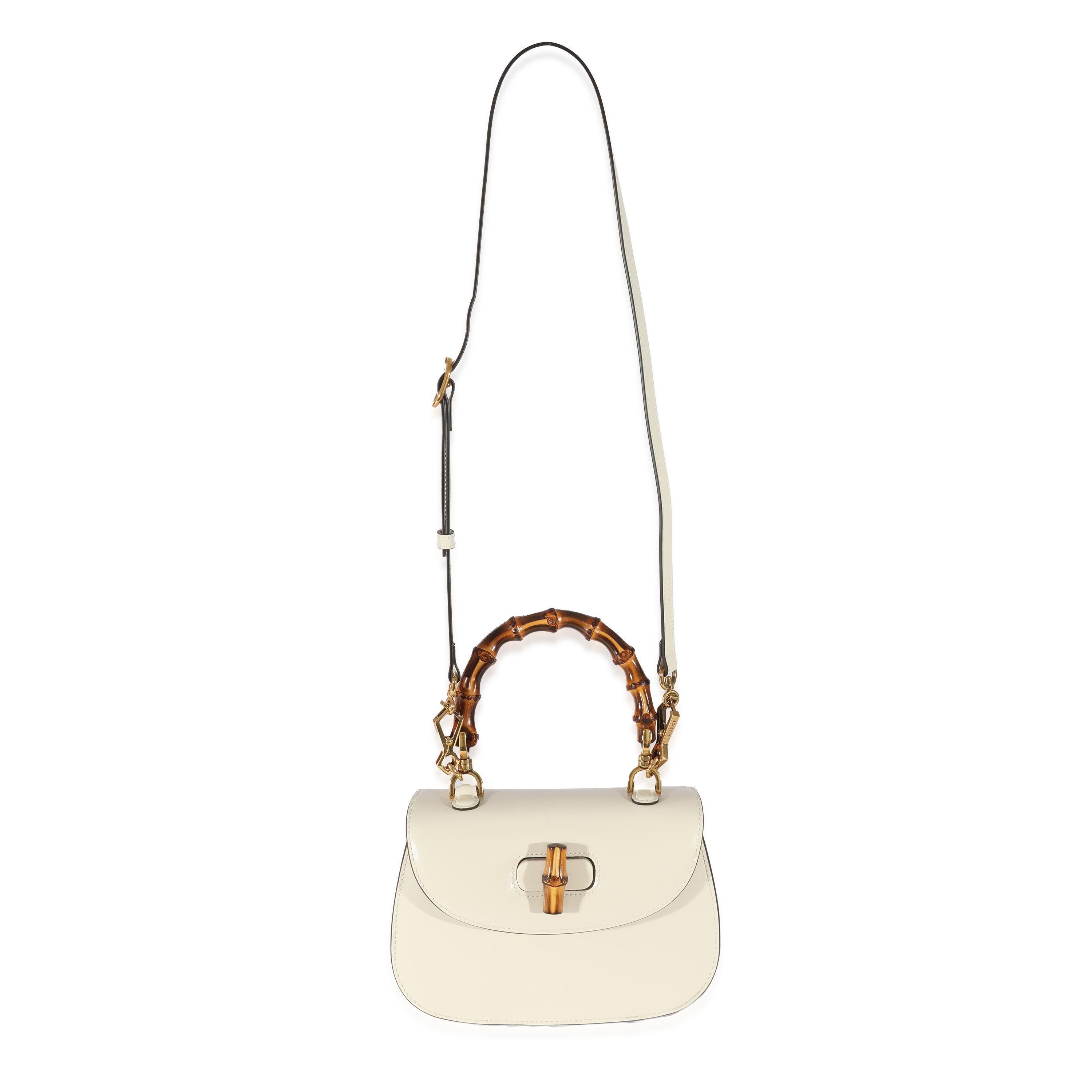 Listing Title: Gucci White Leather Small 1947 Bamboo Top Handle
SKU: 129291
MSRP: 4200.00
Condition: Pre-owned 
Handbag Condition: Excellent
Condition Comments: Excellent Condition. Interior light scuffing and marks.
Brand: Gucci
Model: 1947 Bamboo