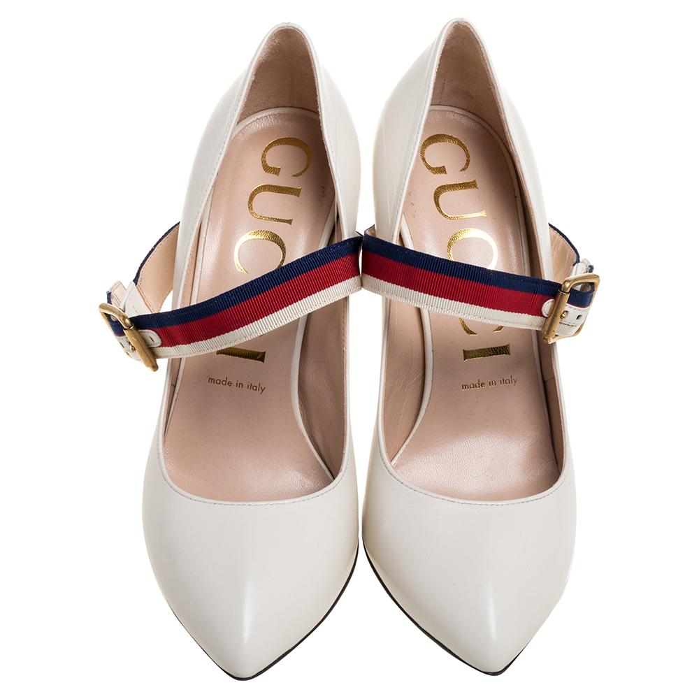 The elegance of these Gucci pumps is unmatchable and can add a sophisticated appeal to your overall look. Crafted from white leather in an almond-toe silhouette, these Sylvie pumps are adorned with buckled straps on the vamps featuring the label's