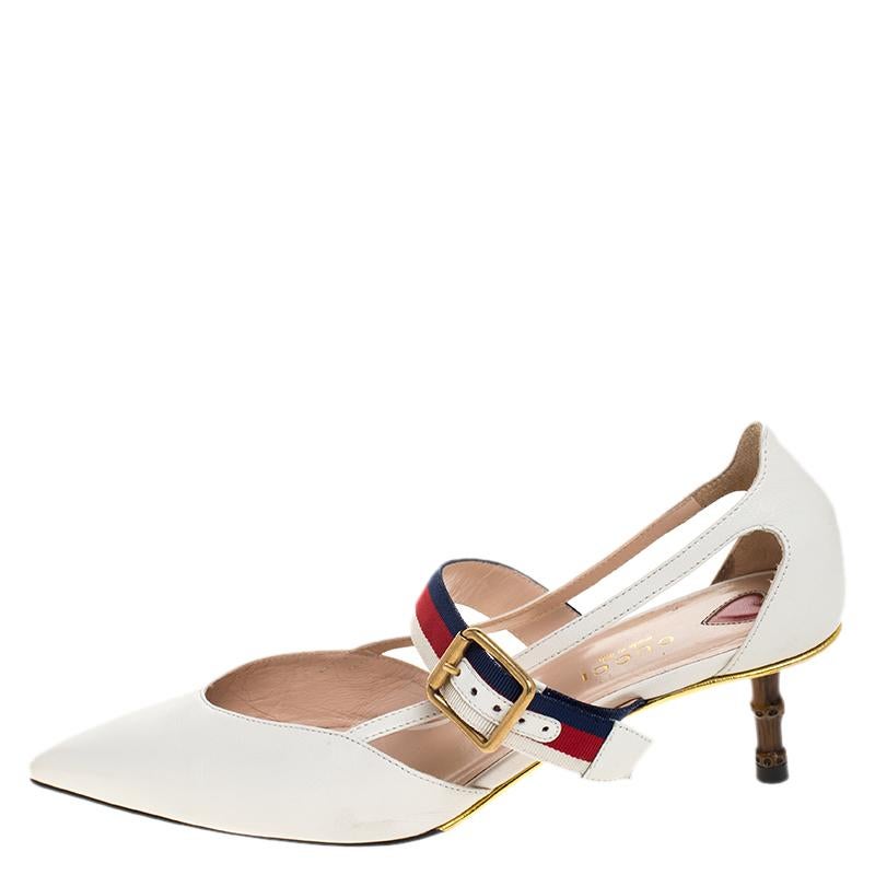 These Unia pumps from Gucci have come straight from a shoe lover's dream. Crafted in Italy from quality leather, they come in a lovely shade of white. Detailed with pointed toes, buckled web straps, gold-tone hardware and balanced on 5.5 cm bamboo