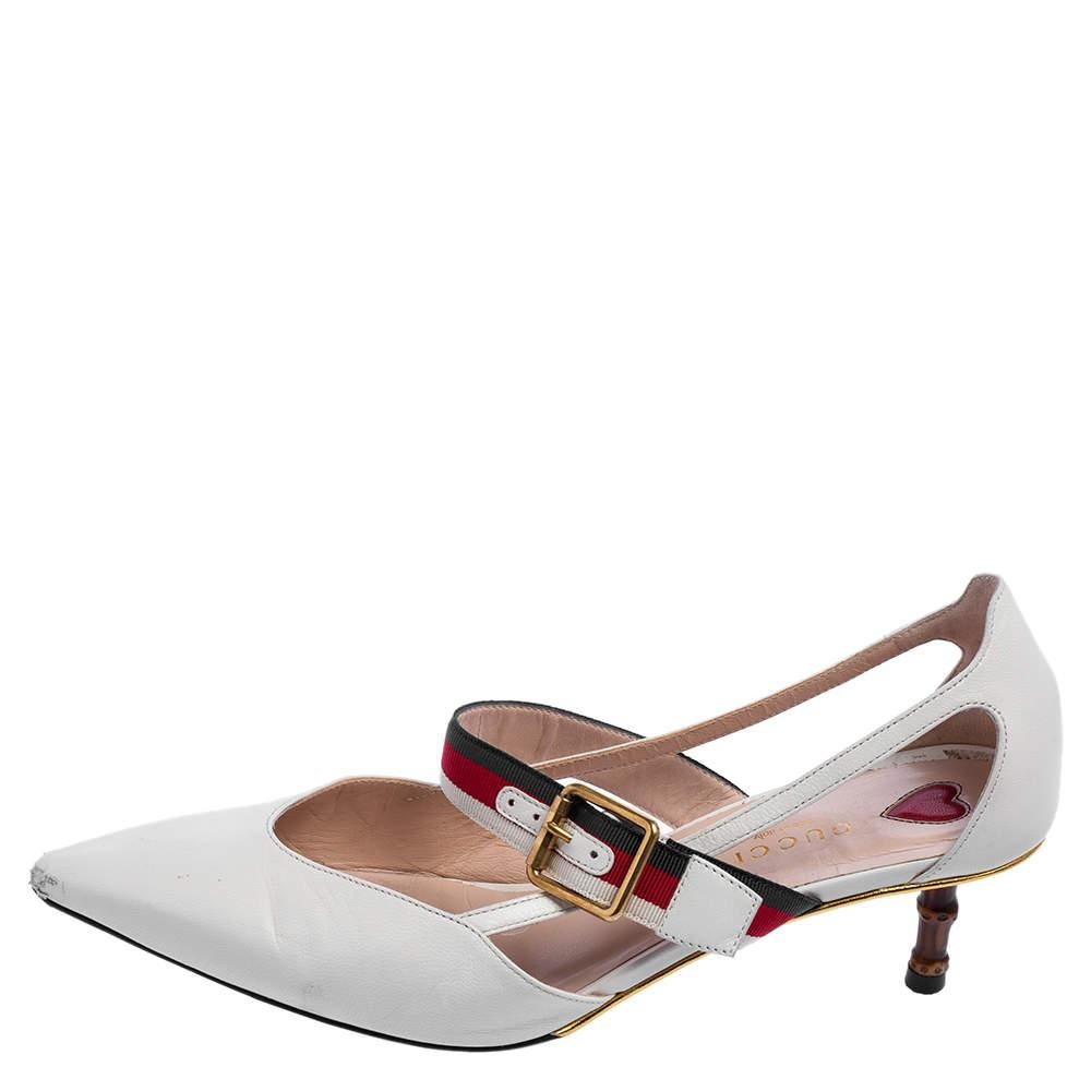 These Unia pumps from Gucci have come straight from a shoe lover's dream. Crafted in Italy from quality leather, they come in a lovely shade of white. Detailed with pointed toes, buckled web straps, gold-tone hardware and balanced on 5.5 cm bamboo