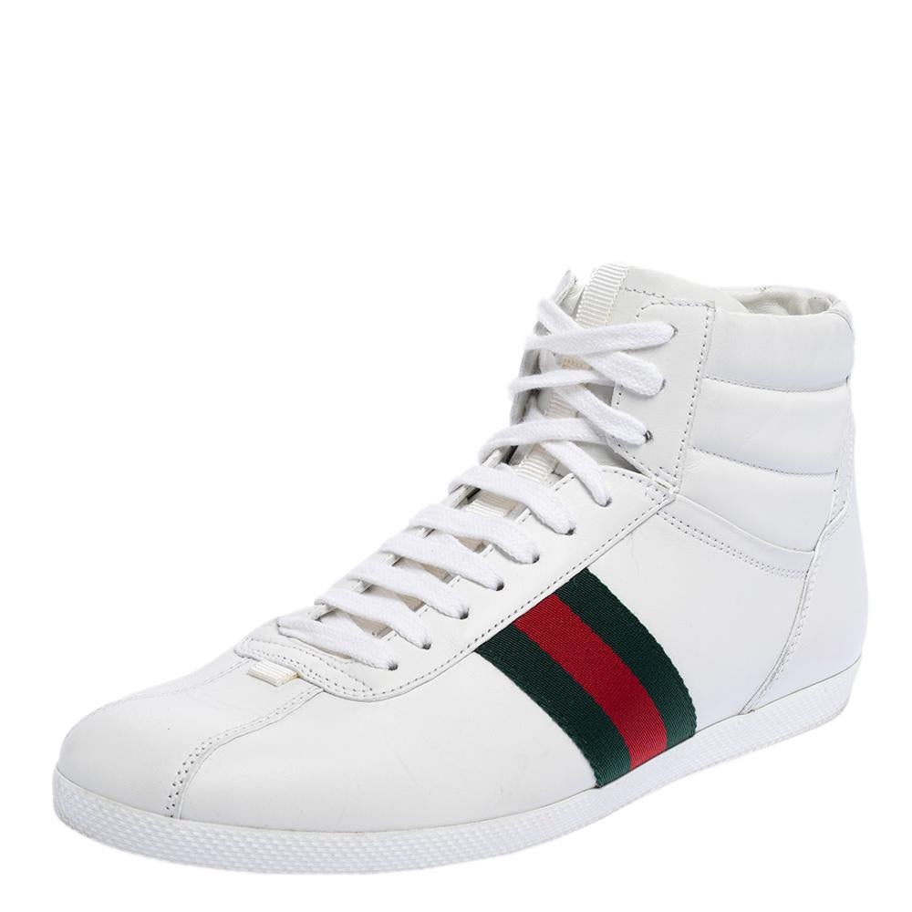 These stylish and comfortable high-top sneakers come from the iconic house of Gucci! They have been crafted in Italy and are made of white leather and feature signature web detailing. The shoes have rubber soles for better grip and front lace-up