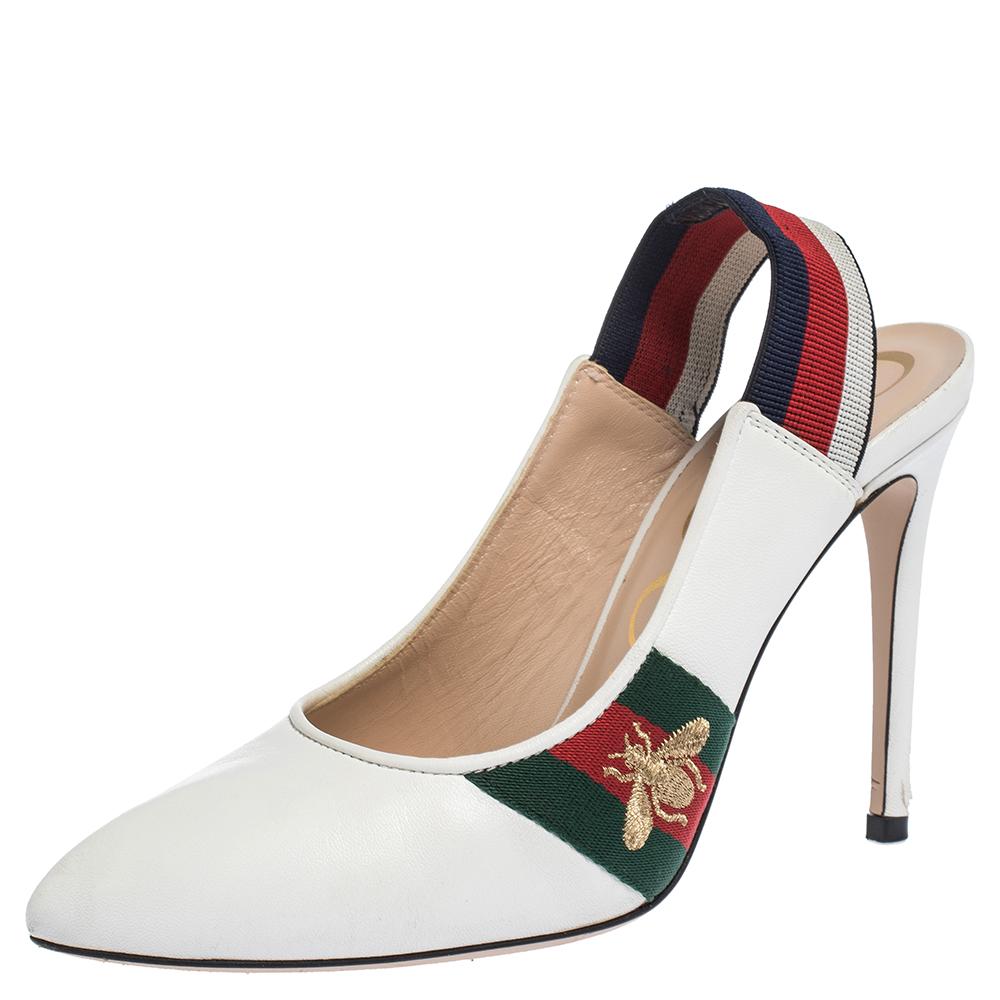 Amp up any outfit with these Gucci Sylvie pumps. Crafted from quality leather in Italy, they feature the signature web strap as elastic slingbacks with pointed toes and sleek 10 cm stiletto heels. The white shade is contrasted with bee-embroidered