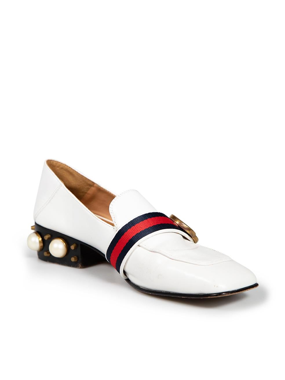 CONDITION is Good. General wear to loafers is evident. Moderate signs of scratches and abrasions to uppers and rear of both shoes. The GG logo on pearl is missing on the left shoe on this used Gucci designer resale item.
 
 
 
 Details
 
 
 White
 
