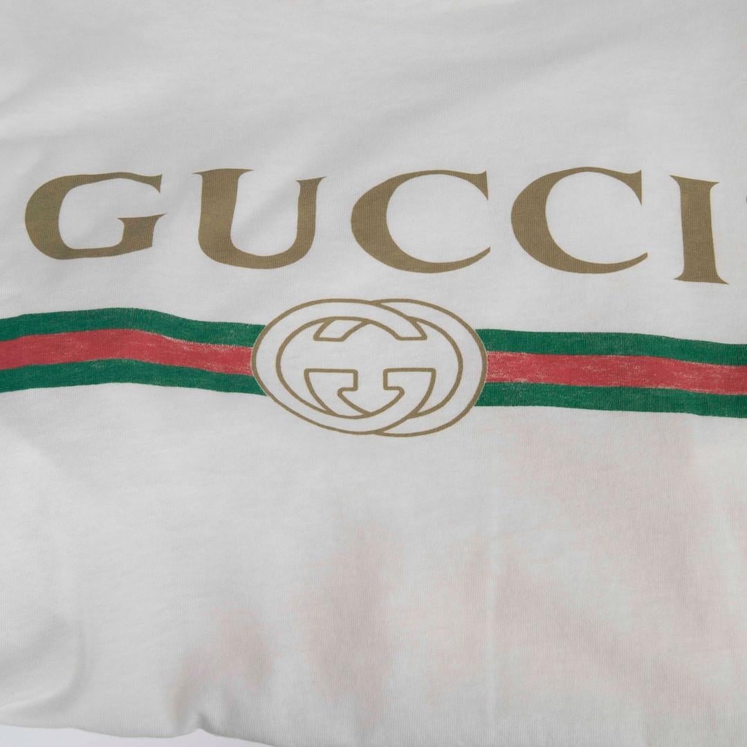 Bianco Gucci Maglietta con logo e patch floreale bianca taglia M. T. I. M. I. in vendita