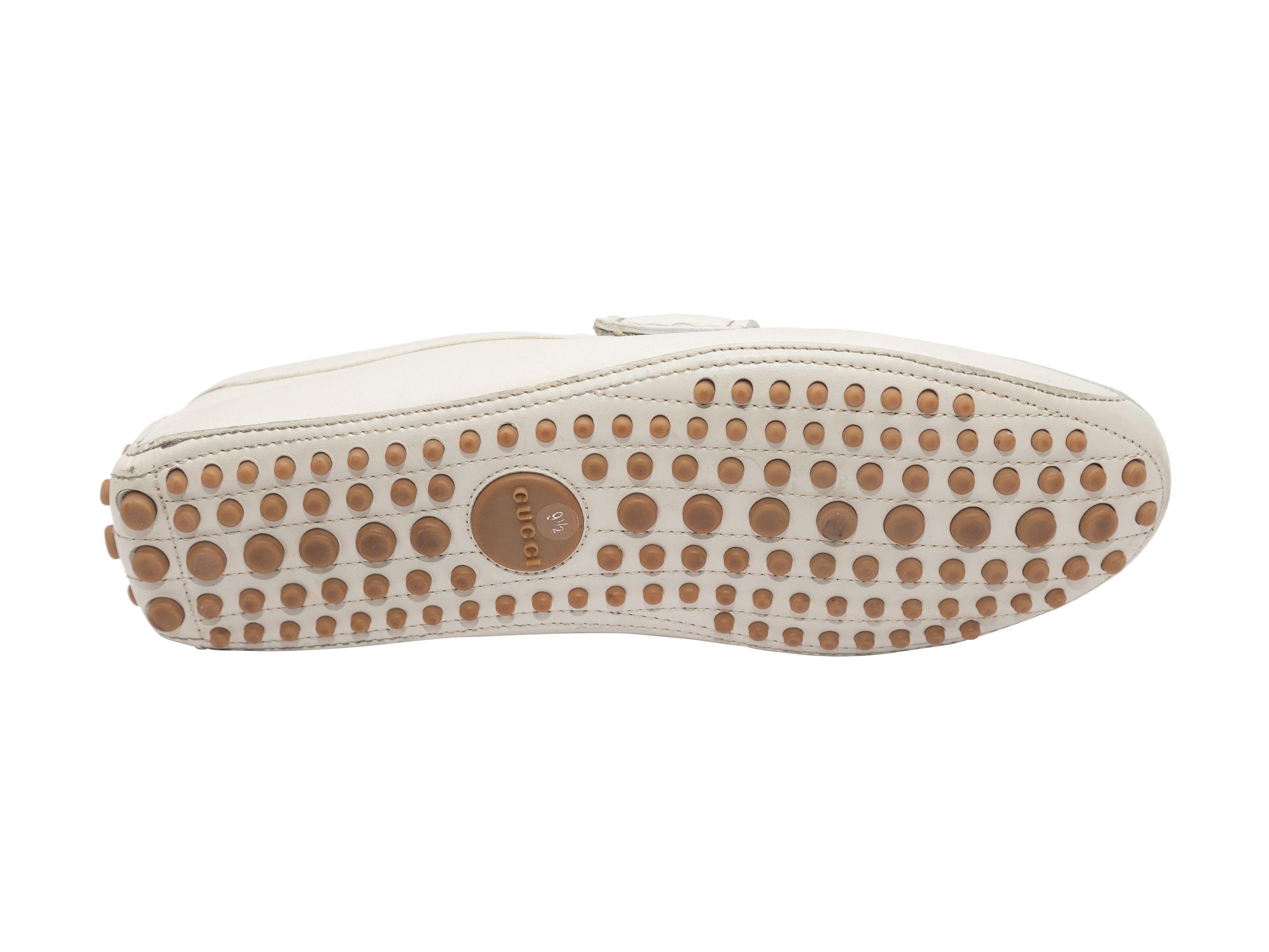 Product Details: White leather men's driving loafers by Gucci. Navy and red Gucci Web trim and bamboo and silver-tone Horsebit accents at tops. Rubber bumpers at counters and at soles.

Designer Size: 39.5
US Recommended Size: 9.5

Condition: