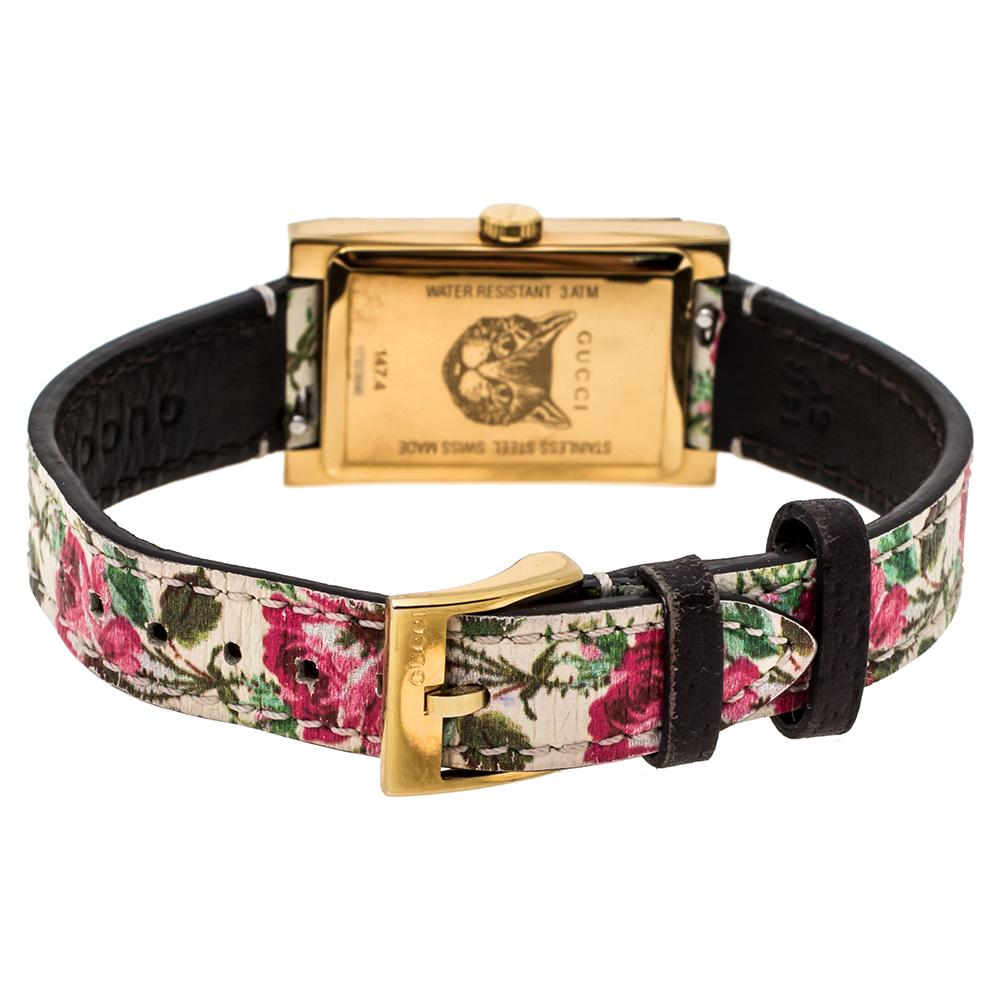 Announce your arrival with this wristwatch from Gucci. The watch has a rectangular, gold-tone stainless steel case with a matching smooth bezel. It encases a beautifully-printed mother of pearl dial which features two steel hands. The watch is