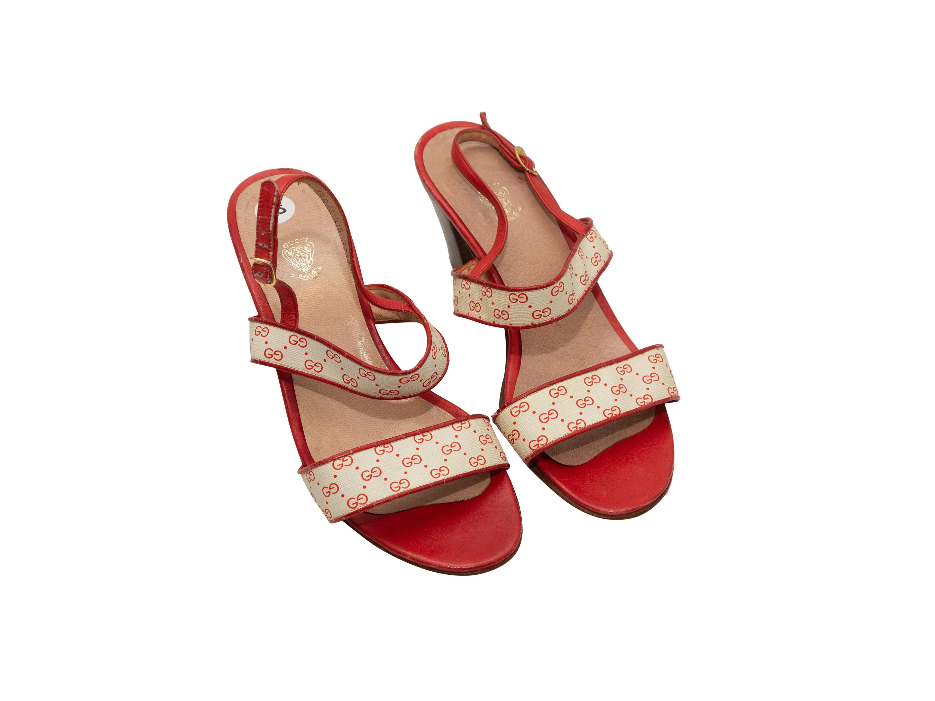 Product details: Vintage white and red GG print slingback sandals by Gucci. Stacked heels. Gold-tone buckle closures at slingback straps. Designer size 37.5. 2.5