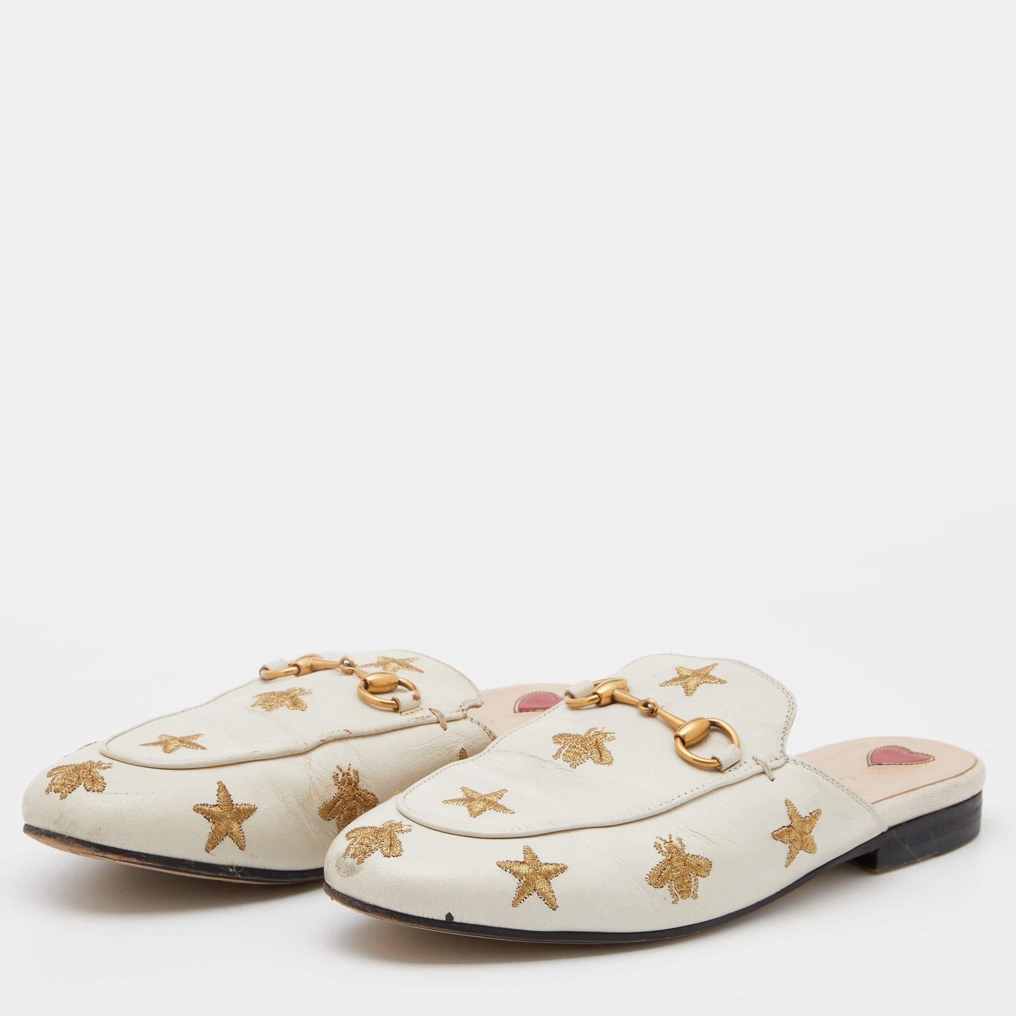 These Gucci Princetown mules are a fresh update on the perennially chic Gucci loafers. They are enhanced by the signature Horsebit hardware, star, and bee motifs that have defined the Gucci collection since the very beginning. Featuring a leather