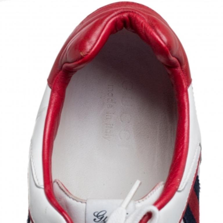 Step into these Gucci sneakers for instant comfort! They feature the iconic Gucci Web detail and mesh trims on the white leather exterior. They flaunt round toes and lace-ups on the vamps. Pair these with casuals for a sporty and fashionable look.