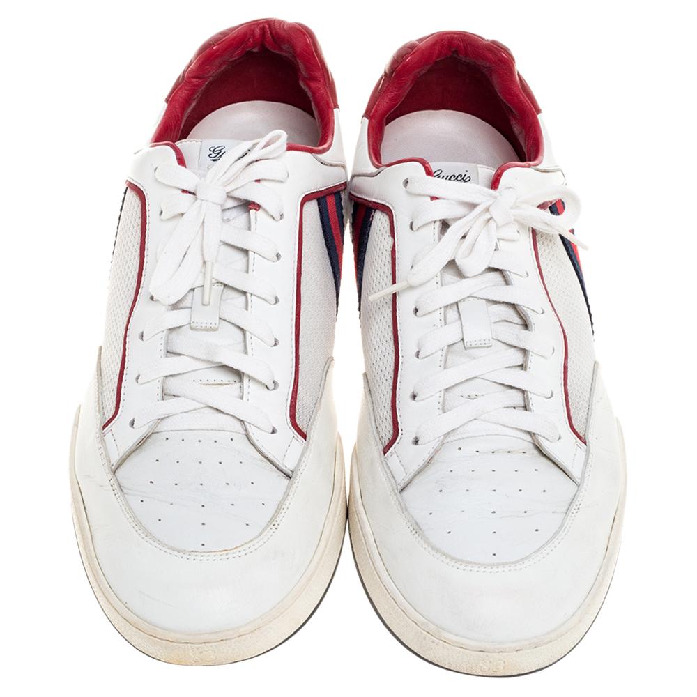 Step into these Gucci sneakers for instant comfort! They feature the iconic Gucci Web detail and mesh trims on the white leather exterior. They flaunt round toes and lace-ups on the vamps. Pair these with casuals for a sporty and fashionable look.

