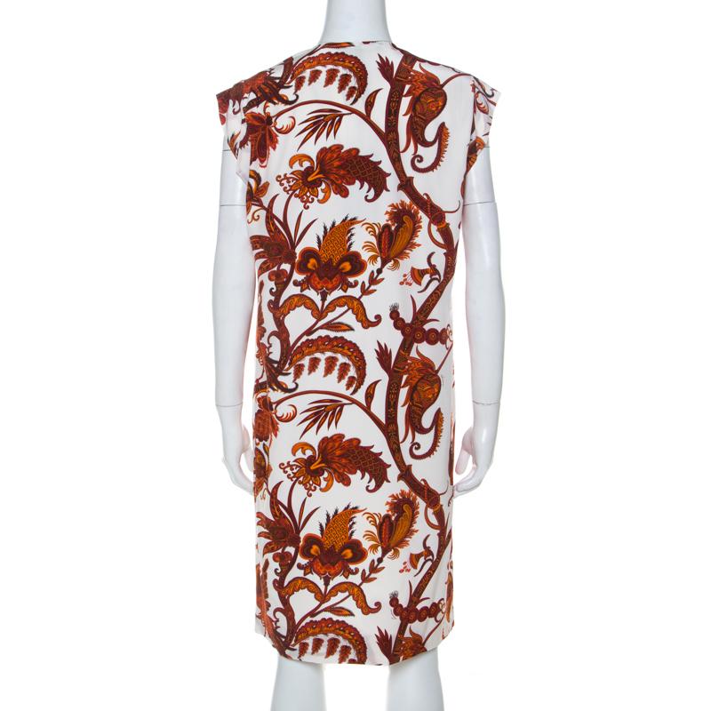 Words fall short to describe this shift dress from Gucci. It comes in white and is designed with paisley prints in orange, a V neckline and a loose fit. The comfortable dress will look great with statement accessories.

Includes: Original Dustbag