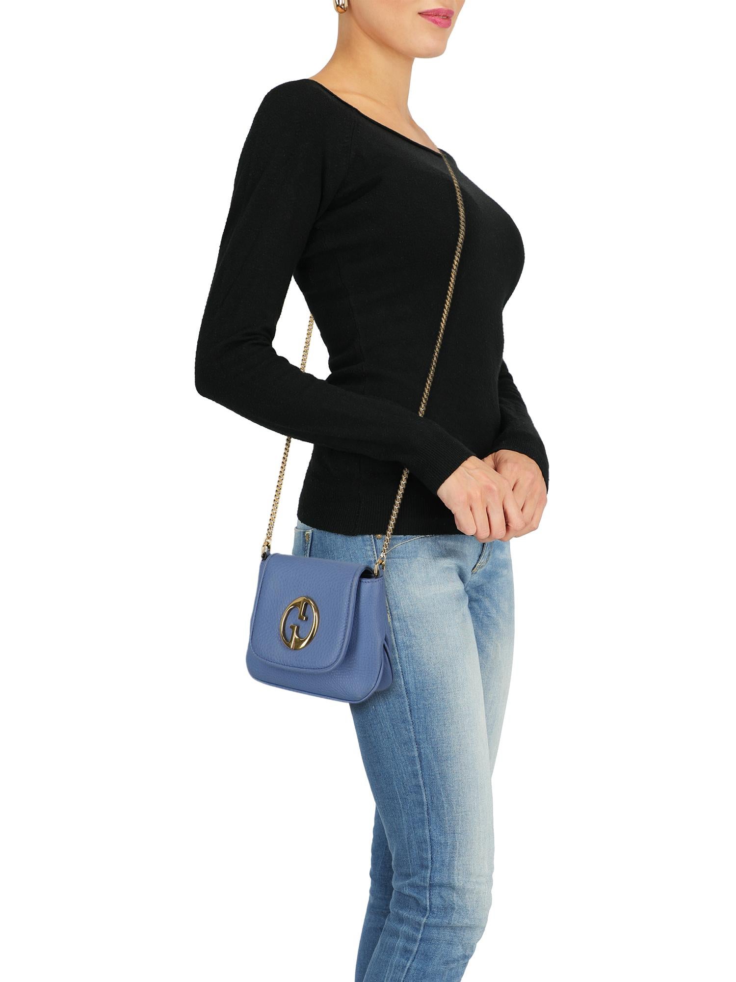 Product Description: 1973, leather, solid color, front logo, button fastening, gold-tone hardware, internal pocket, suede lining, mini bag

Includes:
- Dust bag

Product Condition: Very Good
Lining: negligible residues, slightly visible