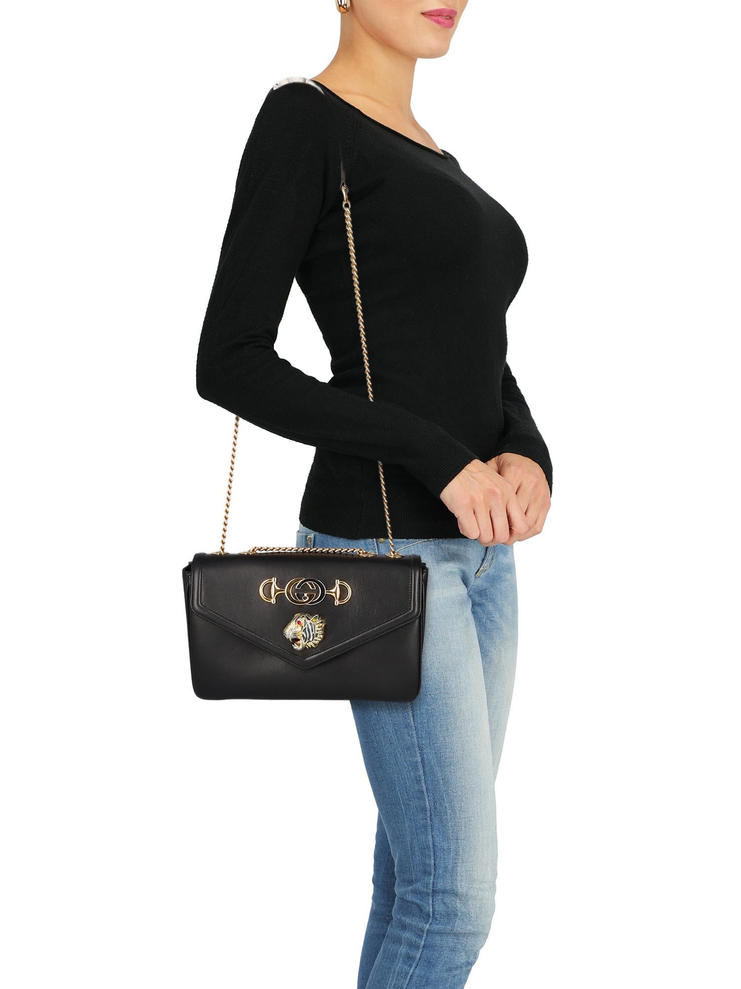 Product Description: Bag, leather, solid color, iconic detail, magnetic closure, gold-tone hardware, internal zipped pocket, internal pocket, day bag

Includes:
Box
 Dust bag

Product Condition: Very Good
Lining: slightly visible stain. External