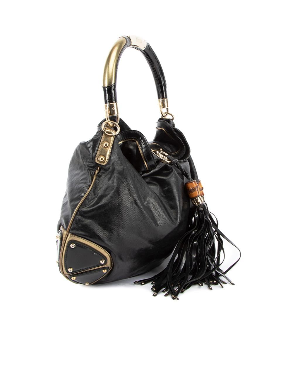 CONDITION is Very good. Minimal wear to bag is evident. Marks can be seen to handle on this used Gucci designer resale item. This item comes with original dust bag.   Details  Black Cloth textile Large hobo bag 2x Oversized tassel with bamboo accent