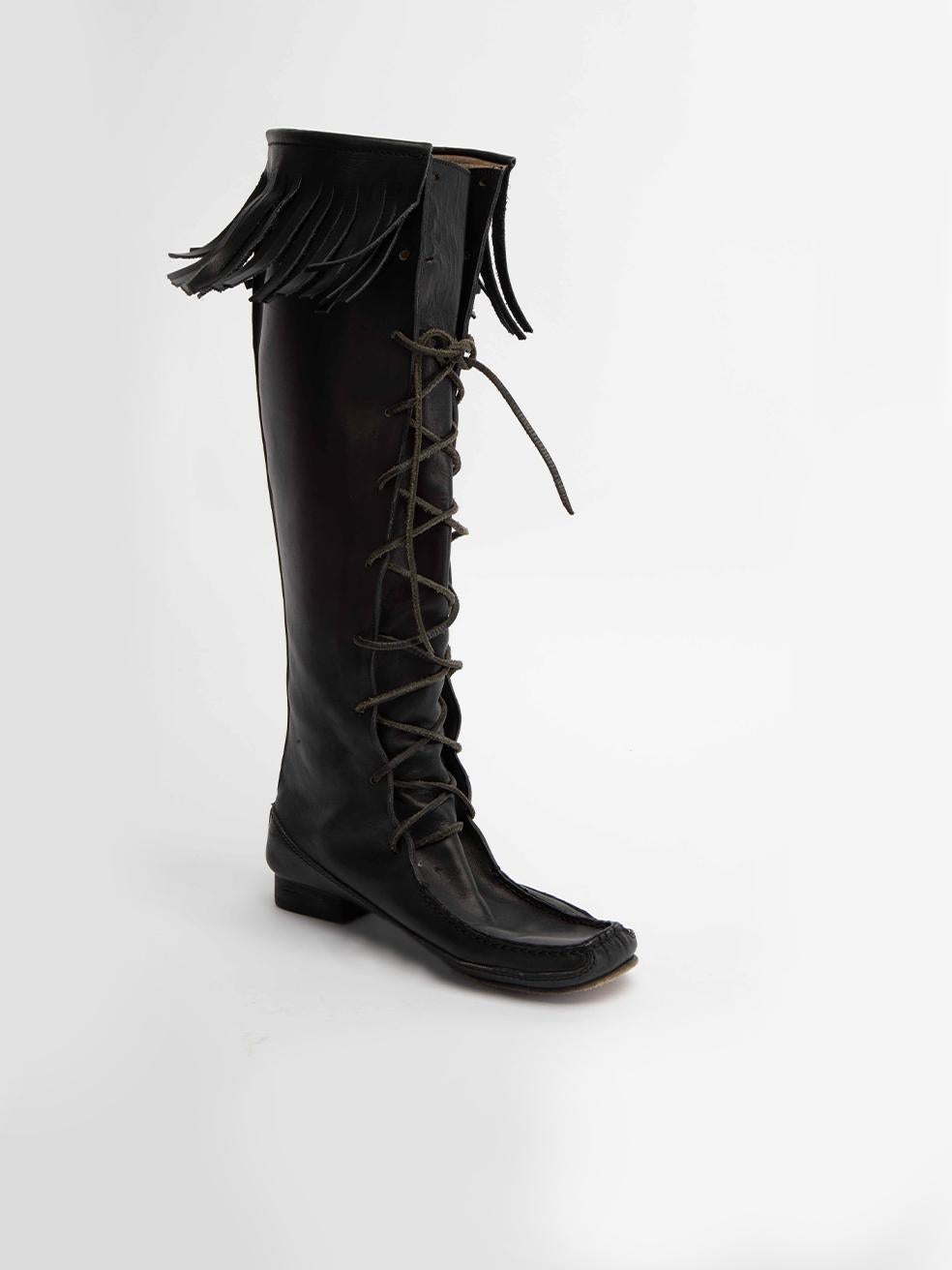 CONDITION is Very good. Minimal wear to shoes is evident. Light creasing to leather material and pilling to laces on this used Gucci designer resale item. 
 
 Details
  Black
 Leather
 Knee high boots
 Square toe
 Kitten block heel
 Lace up closure
