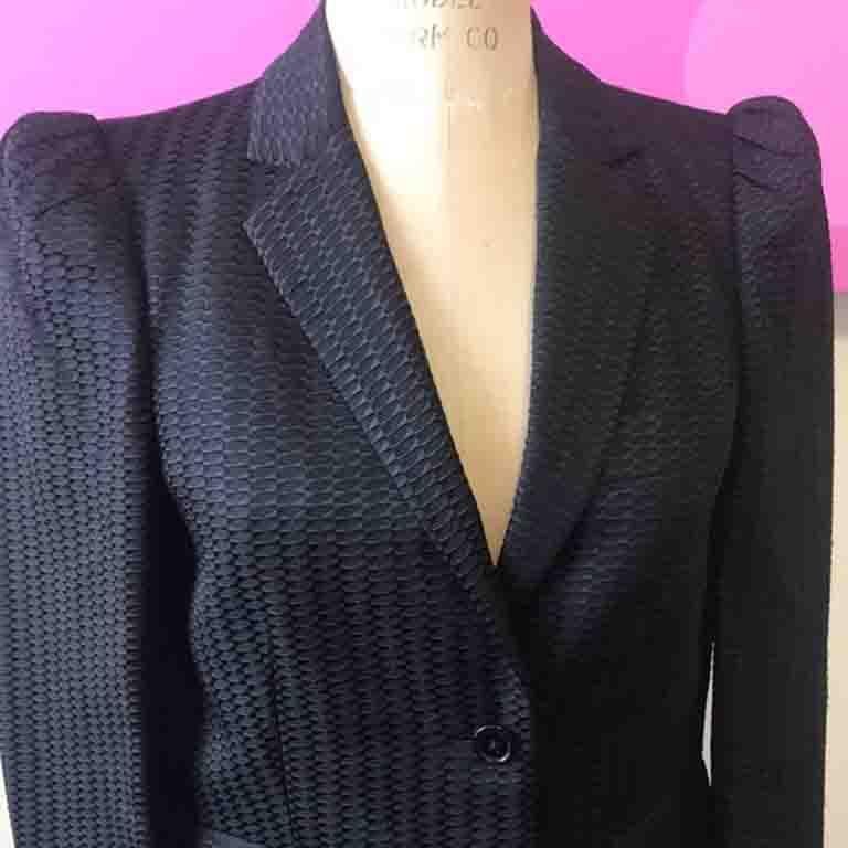 Unique evening jacket tuxedo inspired style by Gucci. Pair with a black pencil skirt or tuxedo pants for a finished look. Textured fabric is lined in silk. Pair with black skinny pants and a white silk blouse for a complete look. A few minor snags