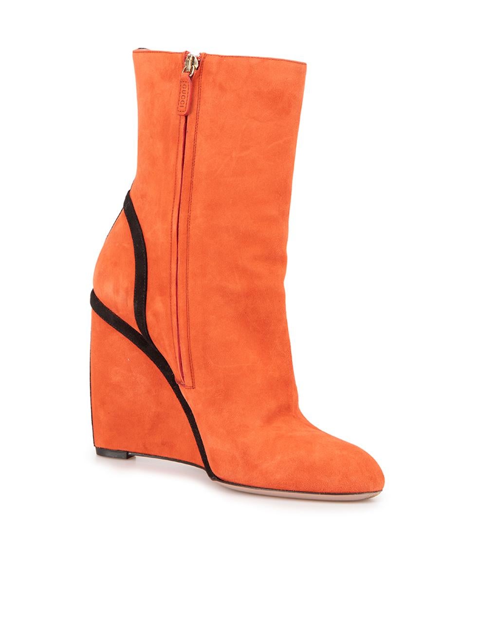 CONDITION is Very good. Minimal wear to wedge boots is evident. Minimal wear to the suede exterior which is scuffed and worn down on this used Gucci designer resale item. This item includes the original dustbag and shoebox.



Details


Orange