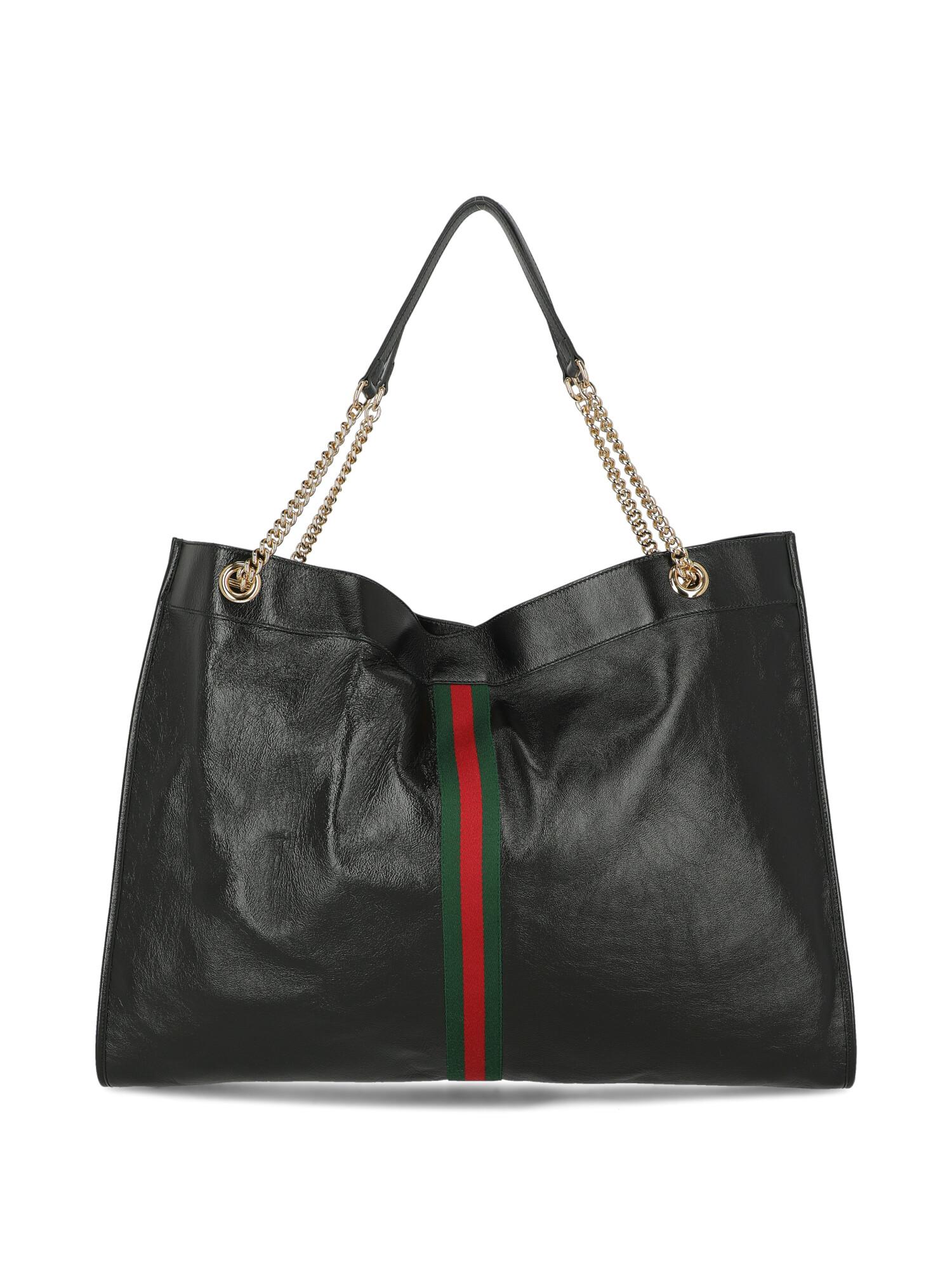 Woman, leather, solid color, iconic detail, magnetic closure, gold-tone hardware, metal application, day bag

Includes:
- Dust bag

Product Condition: Excellent
Hardware: negligible scratches.

Measurements:
Height: 42 cm
Depth: 6 cm
Width: 56