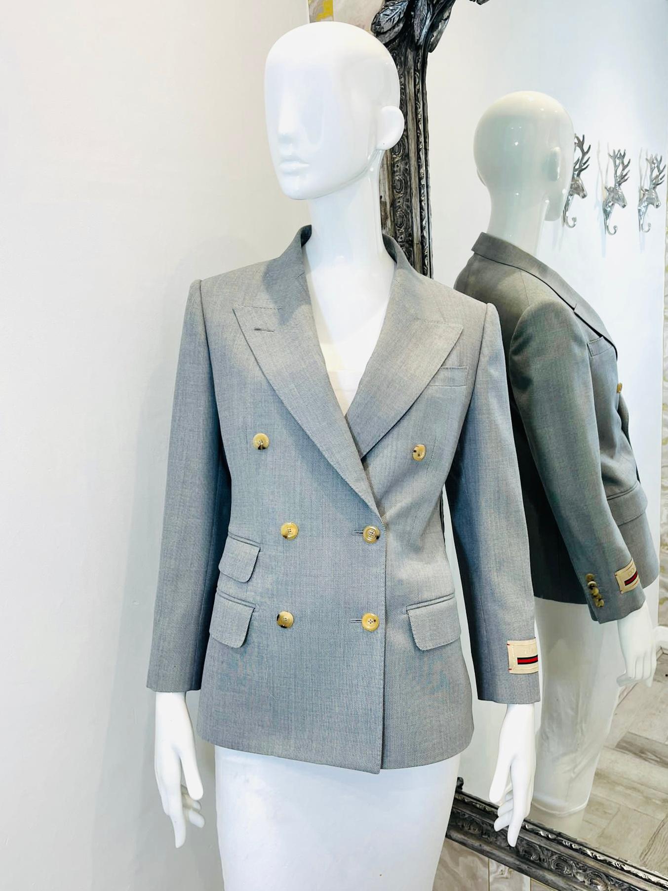Gucci Wool Double Breasted Jacket

From the Aria collection is this two toned grey, sharkskin wool blazer with a vintage feel.

Oversized applique logo patch to one cuff. Flap pockets. Baby blue cotton lining.

Rrp £2,350.

Size - S

Condition -