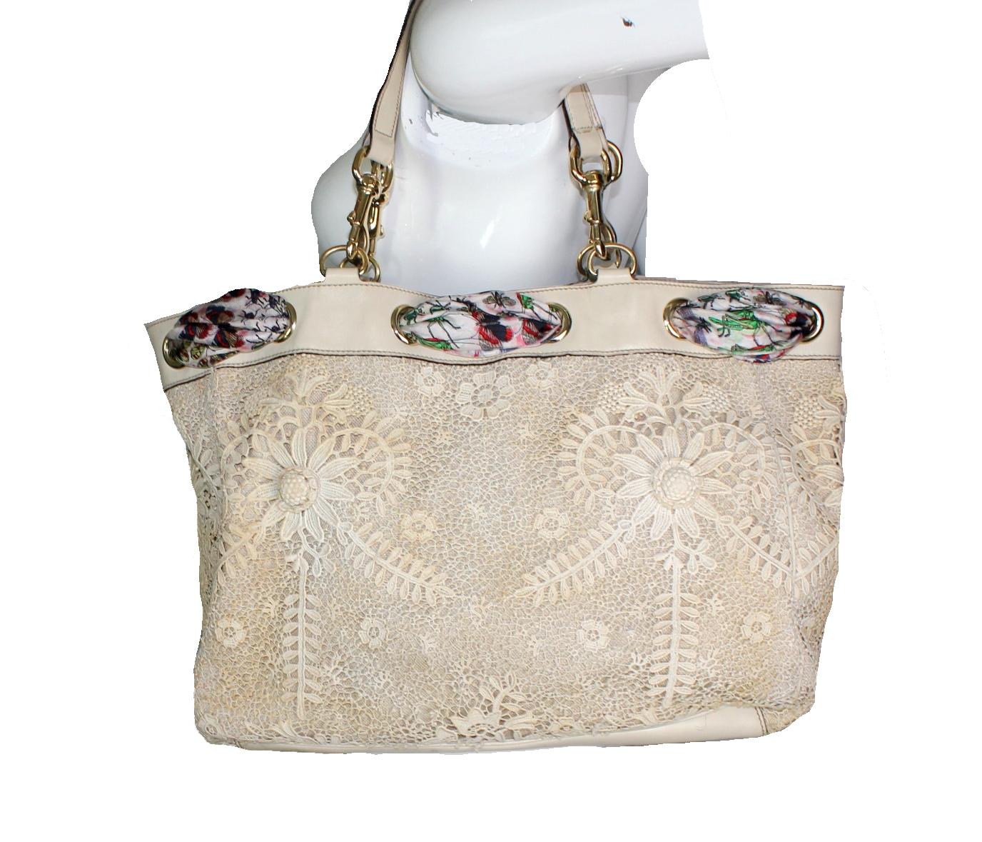 Gucci Woven Lace & Flora Print Silk Tote Bag 

Limited Editon - Only a Few Pieces Were Produced Of This Gorgeous Bag And Sold In Flagship Stores  

Details: 

Made of macrame lace, leather & printed silk fabric with hand-stitched hem
Beautiful print
