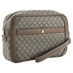 Gucci Wristlet Clutch features brown coated canvas, brown leather trim