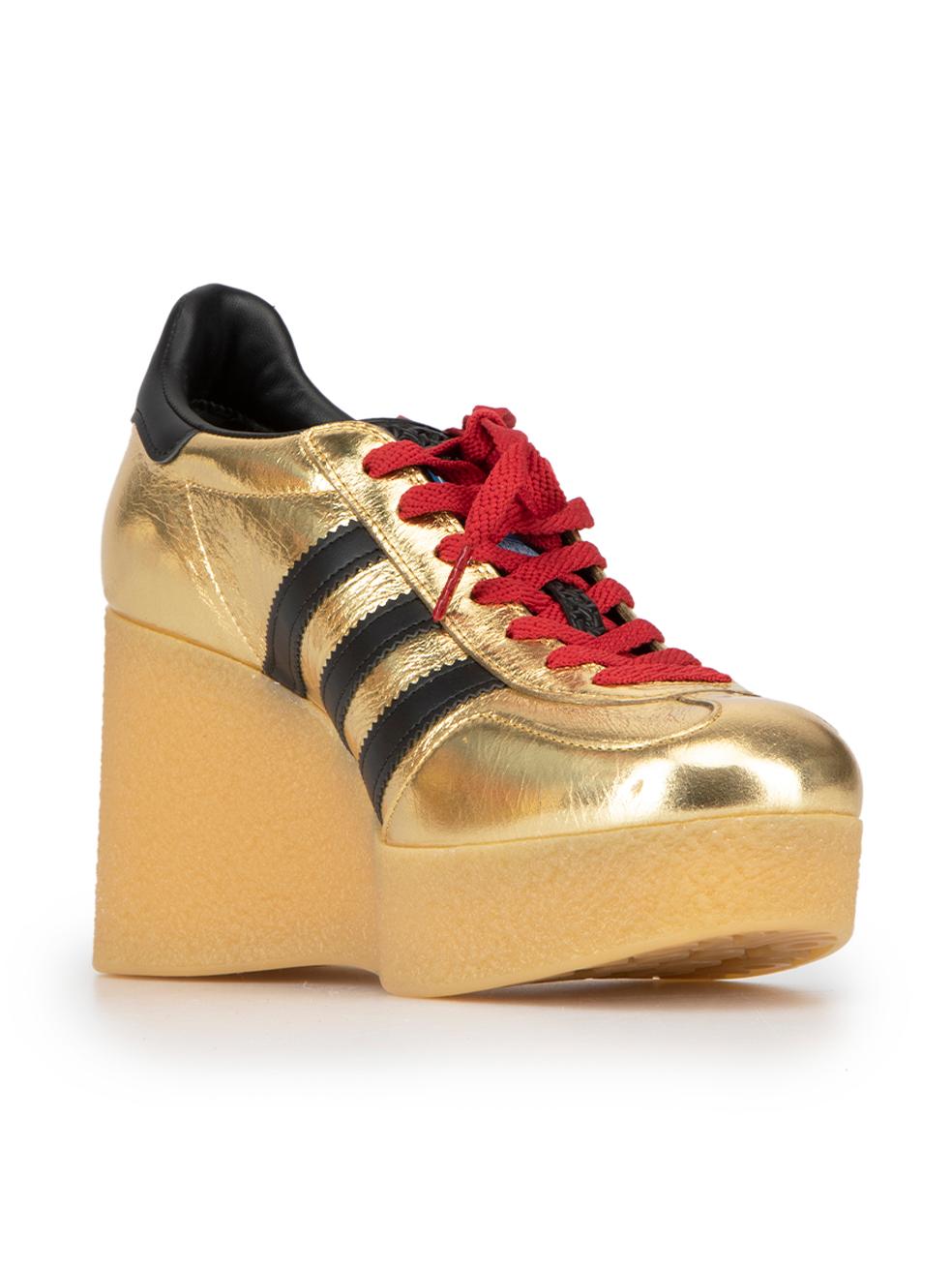 CONDITION is Never Worn. No visible wear to shoes is evident on this used Gucci x Adidas designer resale item. 



Details


Gold

Leather

Low top trainers

Round toe

Wedge high rubber heel

Gucci Trefoil logo label and heel tab

Lace up