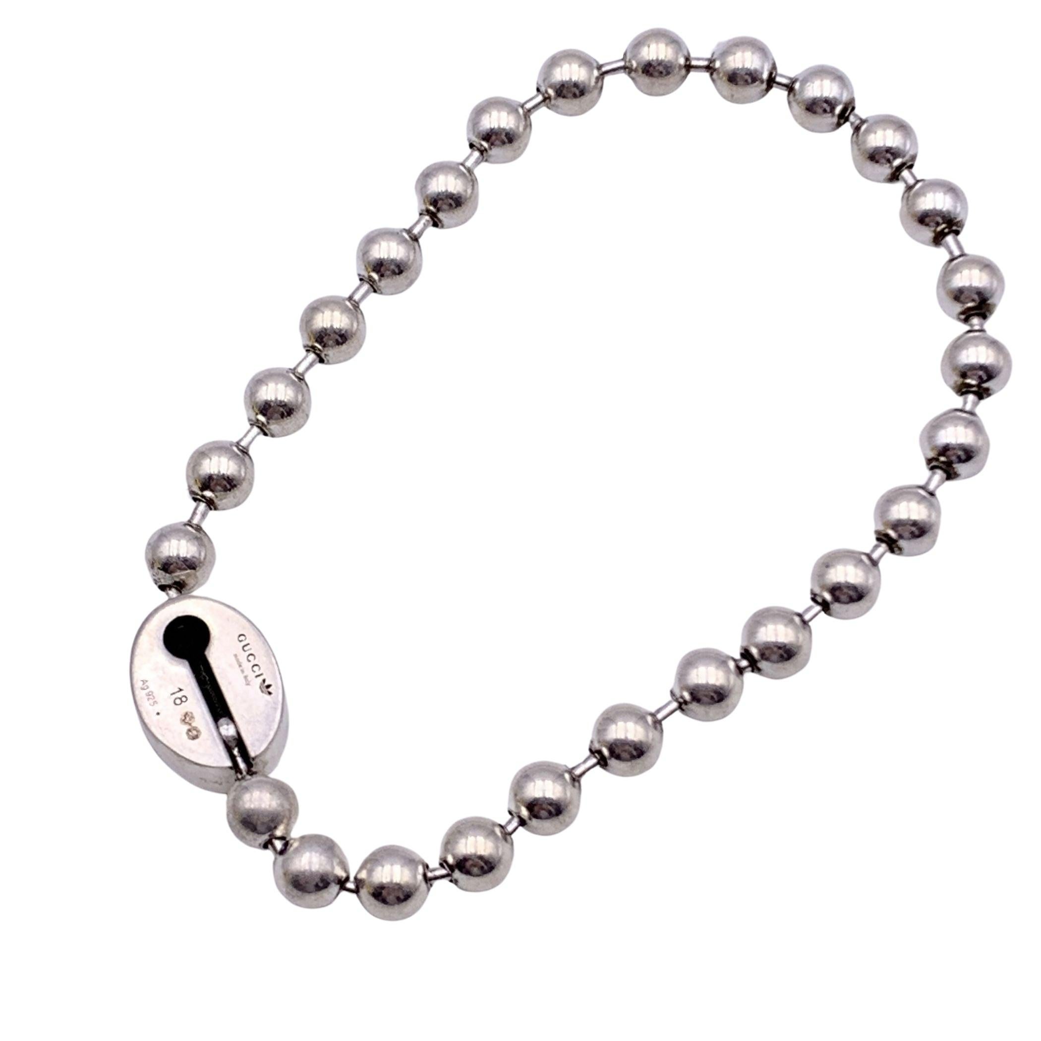 Gucci x Adidas Ball Chain bracelet. Oval Gucci and trefoil logo in black. 'Gucci made in Italy' and 'Arg 925' hallmark engraved on the bracelet. Size 18 cm Condition A - EXCELLENT Gucci box and dustbag included. Please, look carefully at the photos