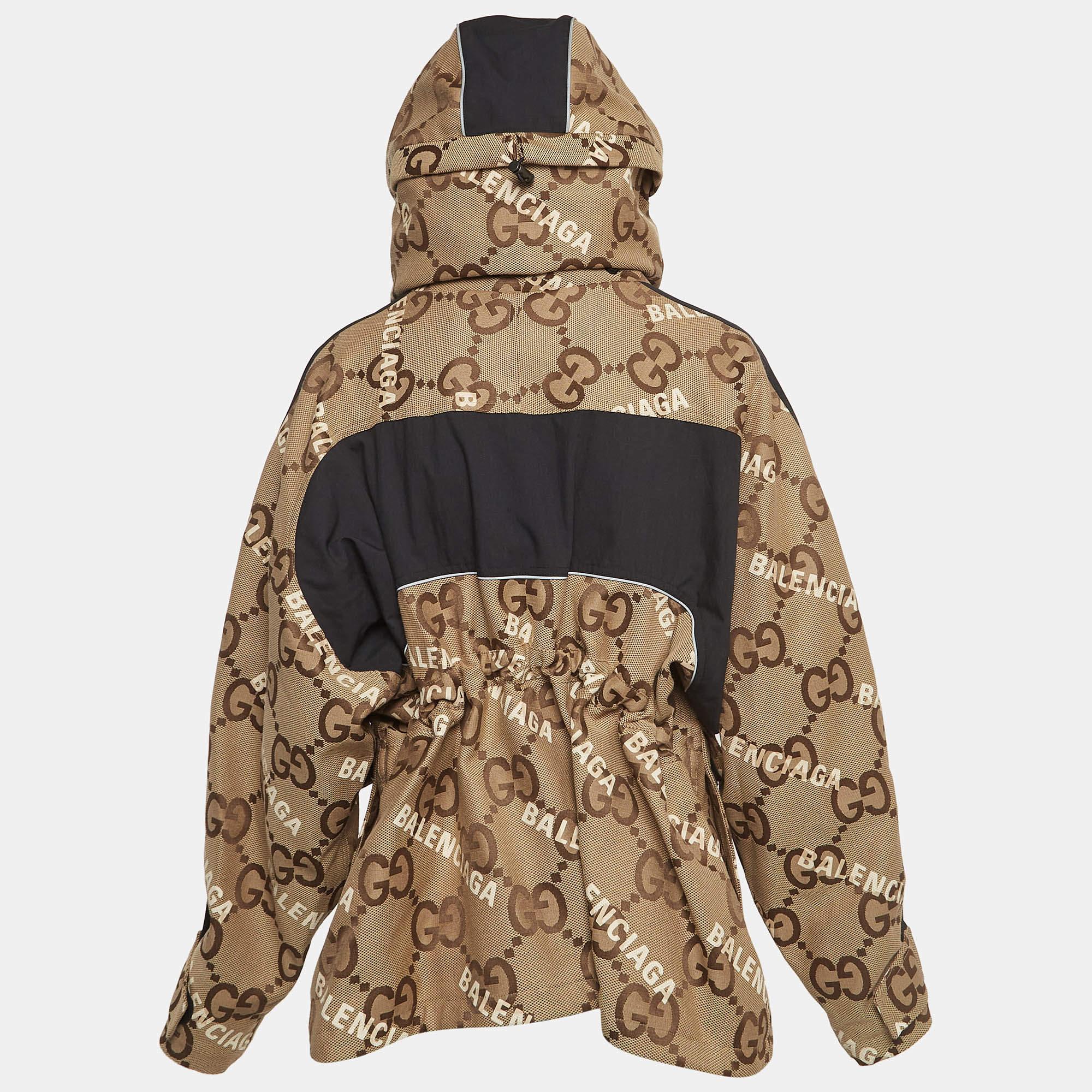 The Gucci x Balenciaga Hacker Project Jacket merges iconic branding with contemporary flair. Crafted from premium materials this unique piece features an oversized GG canvas sleek tailoring and collaborative logos. A statement in high fashion it