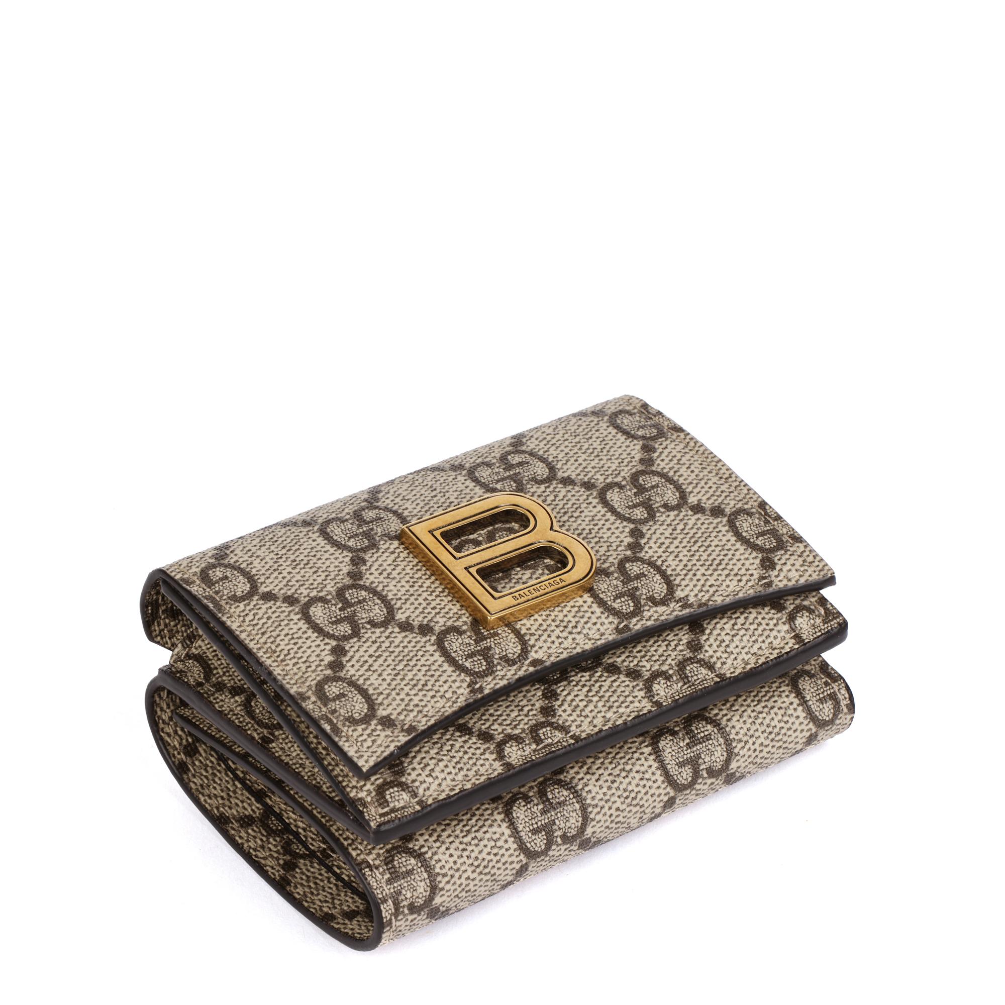 Gucci x Balenciaga GG Supreme Canvas The Hacker Project Hourglass Card Case Wallet

CONDITION NOTES
The exterior is excellent condition with light signs of use.
The interior is in excellent condition with light signs of use.
The hardware is in