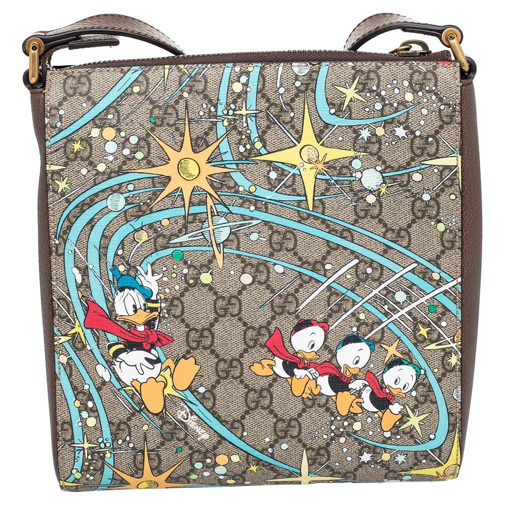 This Donald Duck messenger bag is from the Gucci x Disney collaboration. Crafted using GG Supreme canvas and leather, the bag has a smart shape, a zip pocket at the front, a shoulder strap, and a well-lined interior. The cute prints and the GG