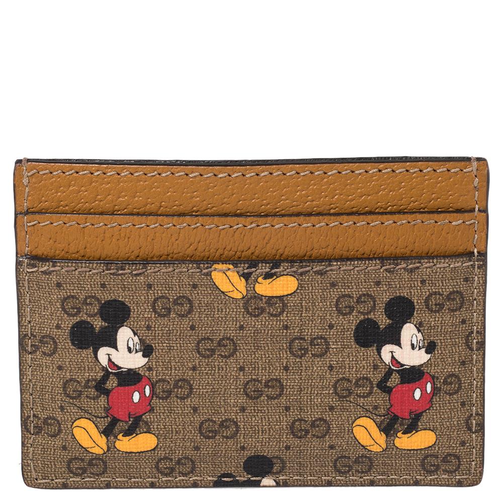This Gucci card holder comes in a signature style made from GG Supreme canvas and leather. It has open slots to carry your important cards and the GG logo at the front. However, the highlight of this creation is the mickey mouse print.

Includes: